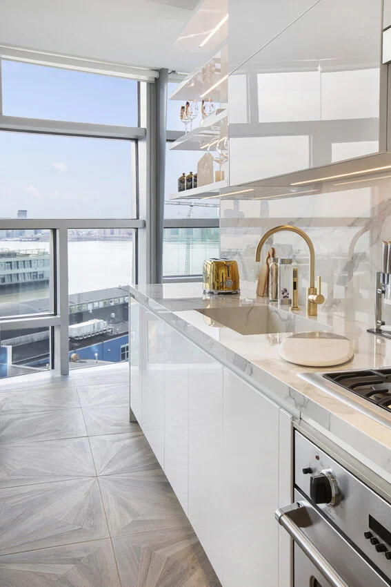 Wide kitchen view in Chelsea NYC apartment, designed by Gregory Hitchcock Design.