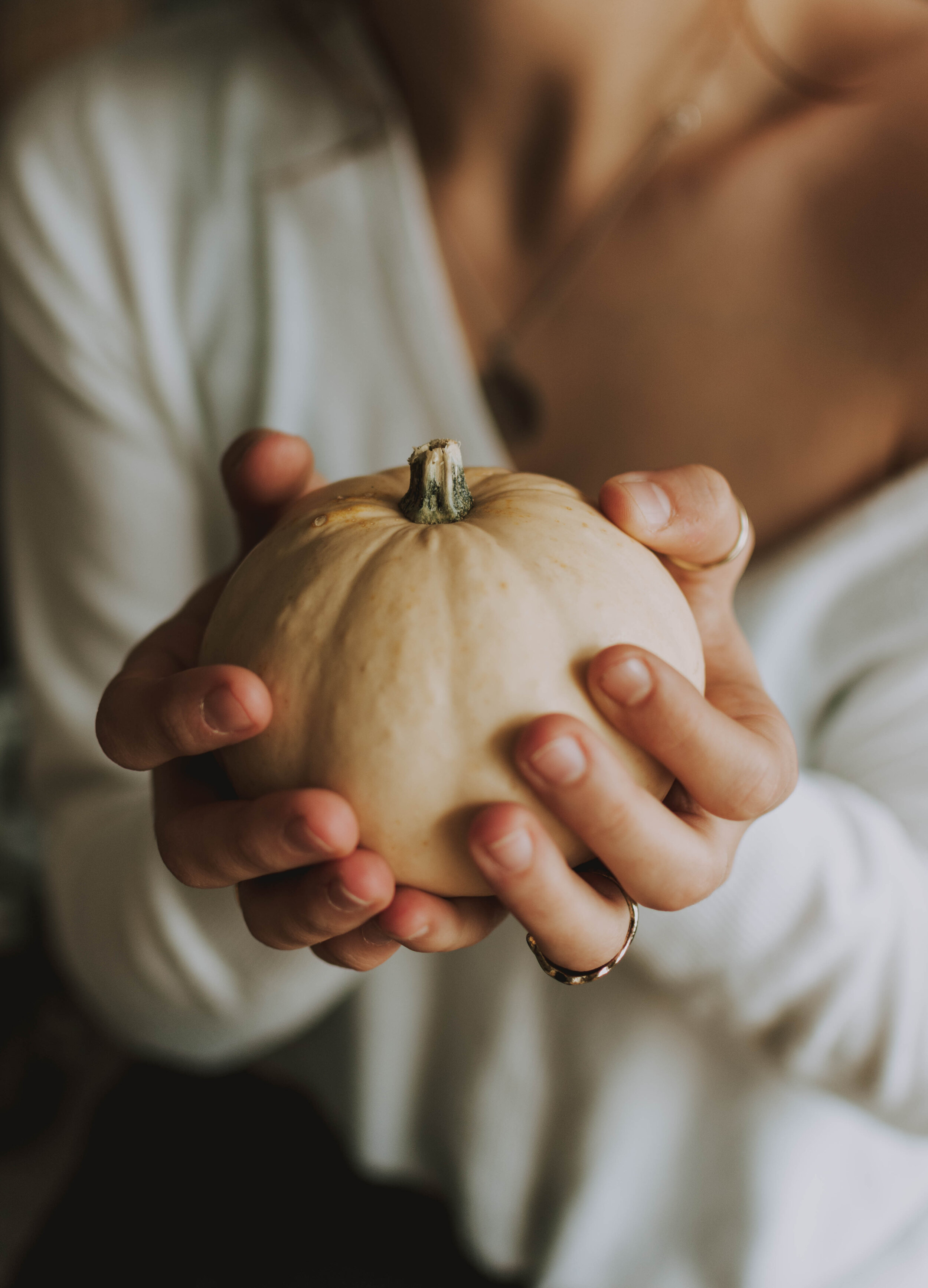 Canva - Woman Holding Pumpkin With Both Hands.jpg