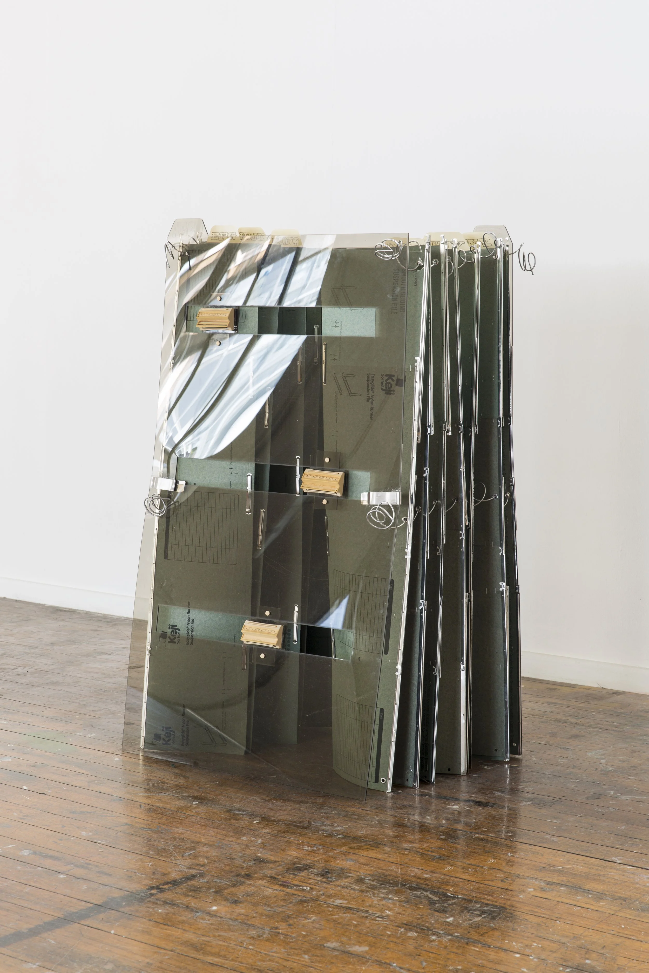   Archival   Perspex, found folders, found Namco filing cabinet tabs, magnets, steel wire, assorted fixtures  Documentation by Lucy Foster, 2019 