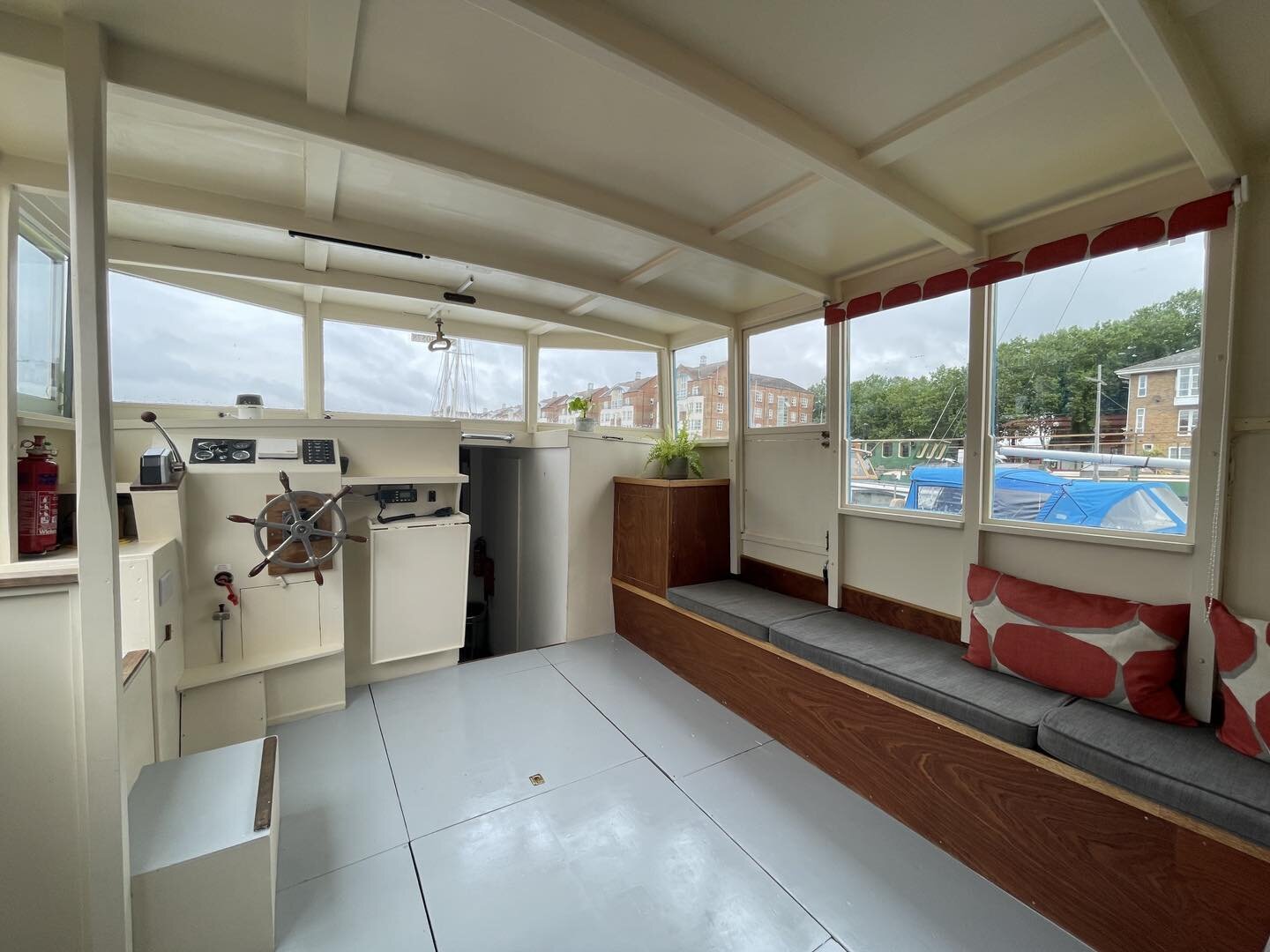 Plenty of room for a dining table or #wfh deck in the bright wheelhouse of his converted Admiralty  launch for sale #greenlanddock #greenlanddocks #boatsforsale #surreyquays #canadawater #southdockmarina #boatsforsaleuk #liveaboard #liveaboardlife  #