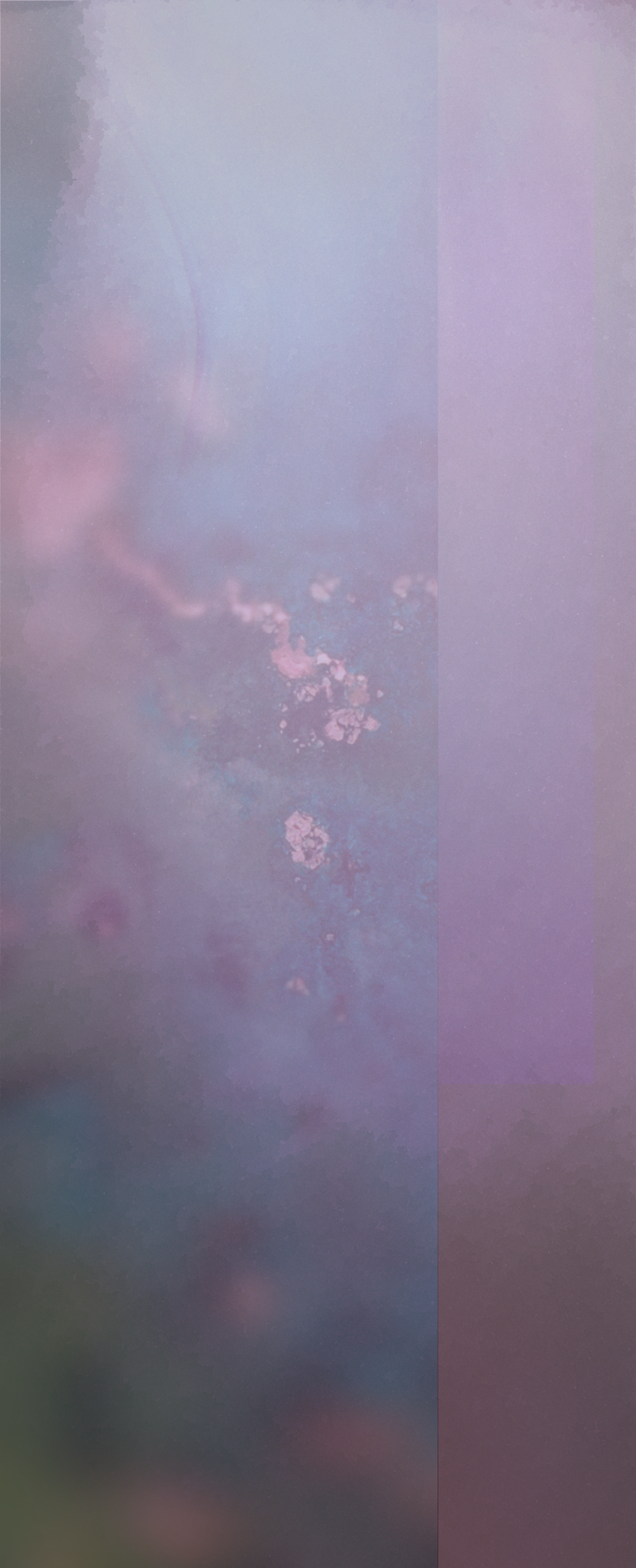 A blurry, abstract background with soft pastel colors, including pink, purple, and blue, with some scattered small light patches and a faint curved line.