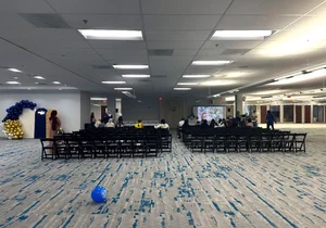 Rows of chairs set up for a ceremony in the hall