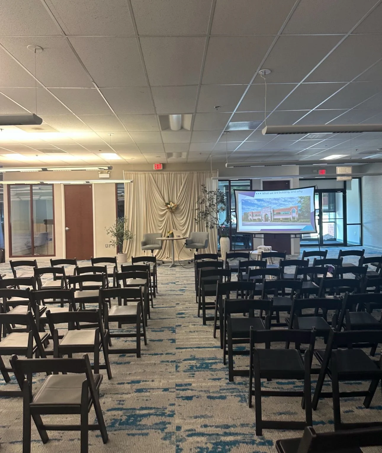 Chairs set in rows facing a screen