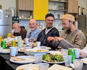 Brothers sharing a meal in the MFC caf&eacute;