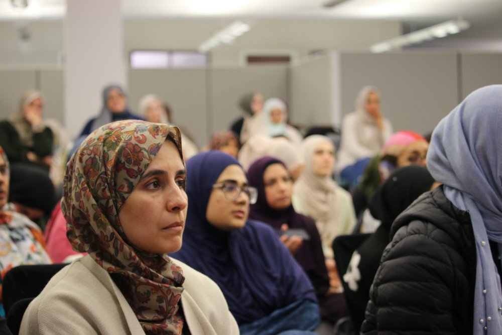 Community members listening during a gathering