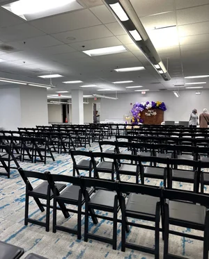 Theater-style seating with a floral display