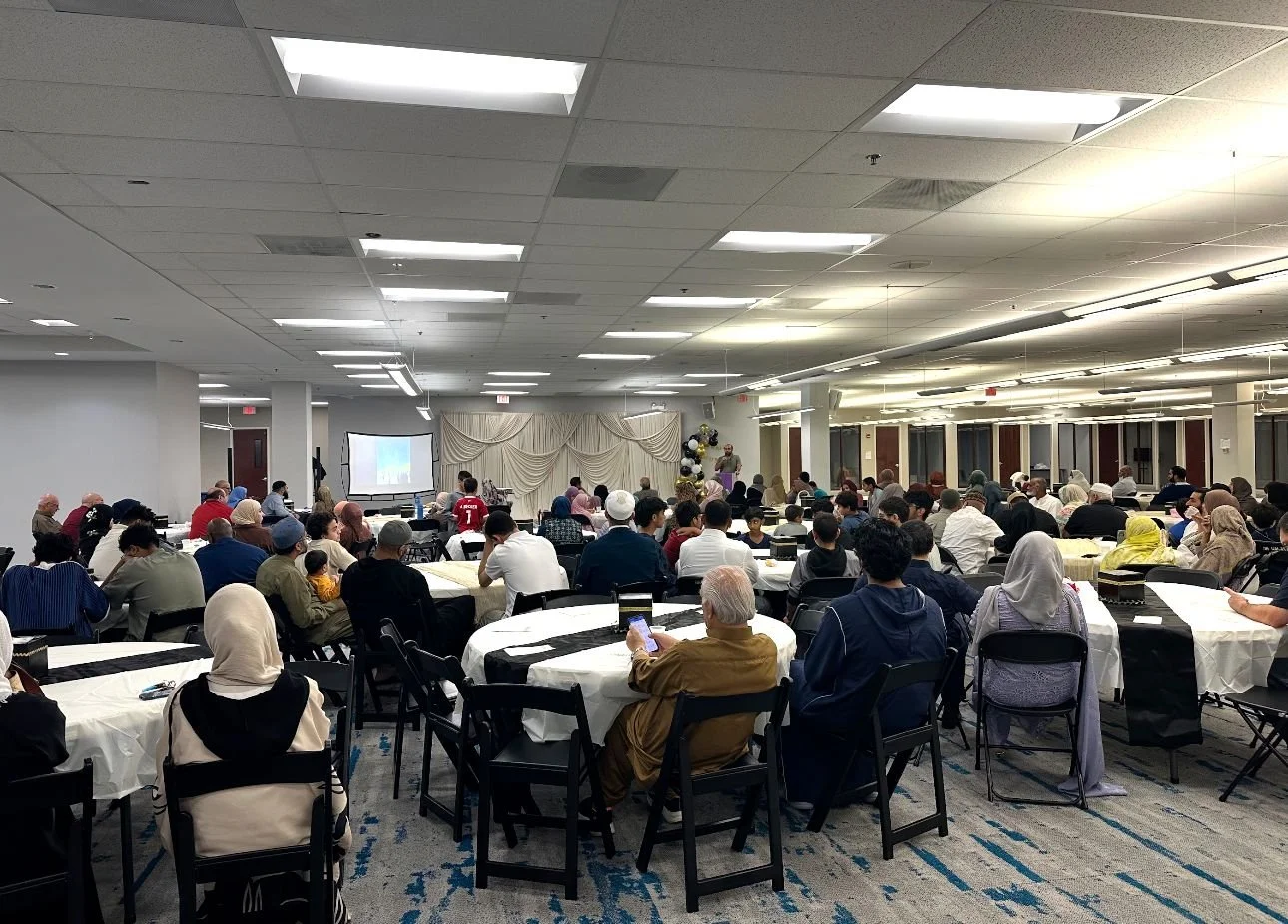 A full hall of guests at a community banquet