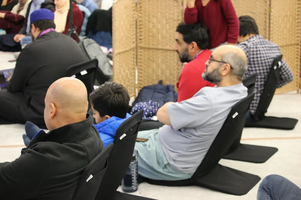 Brothers and children seated for a talk