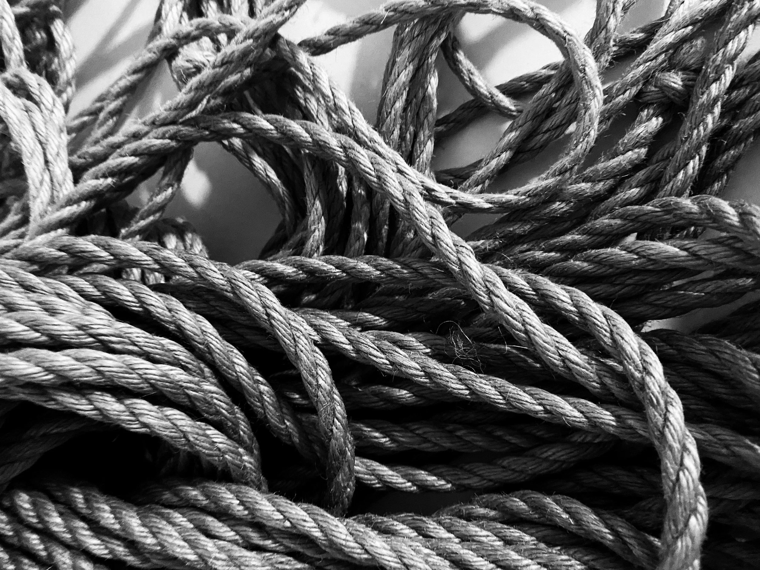 Tangled rope as a metaphor for untangling a founder’s default patterns around pricing, people-pleasing, and overwork
