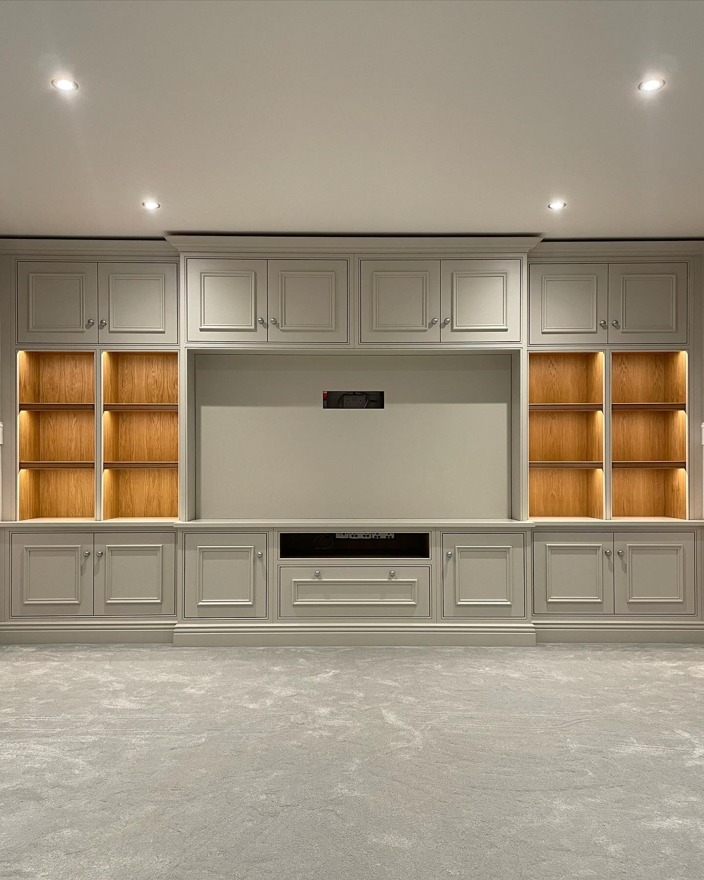 Finished photos of this stunning in-frame media unit completed in Whitchurch. Definitely a favourite of mine, I love the stepped design and the contrast between the colour and the oak which is complimented by the LED strip lighting. 
Consisting of tr