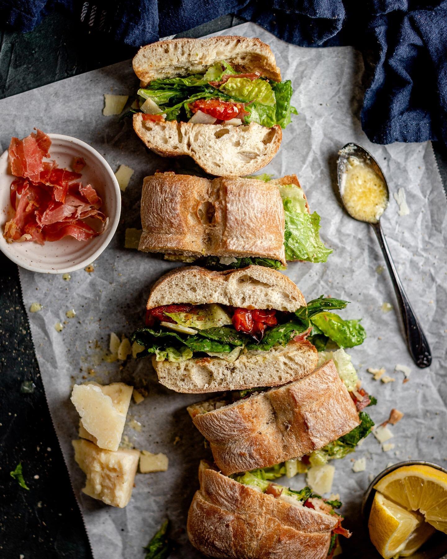 It&rsquo;s the kind of sandwich that&rsquo;s meant for sunny weekends in the backyard...and the recipe is on the blog. This Caesar salad sandwich is everything a sandwich should be: crunchy, salty, saucy and messy. You could try to eat it alone but i