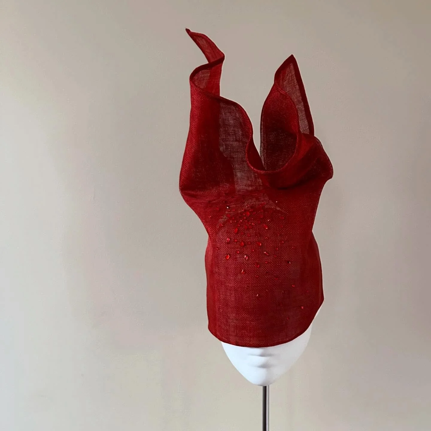 It&rsquo;s no secret that I love working with sinamay. Its woven structure aligns with traditional warp and weft manipulation, making its sculptural properties supreme.

As someone who plans most things, I love the process of being led by the materia