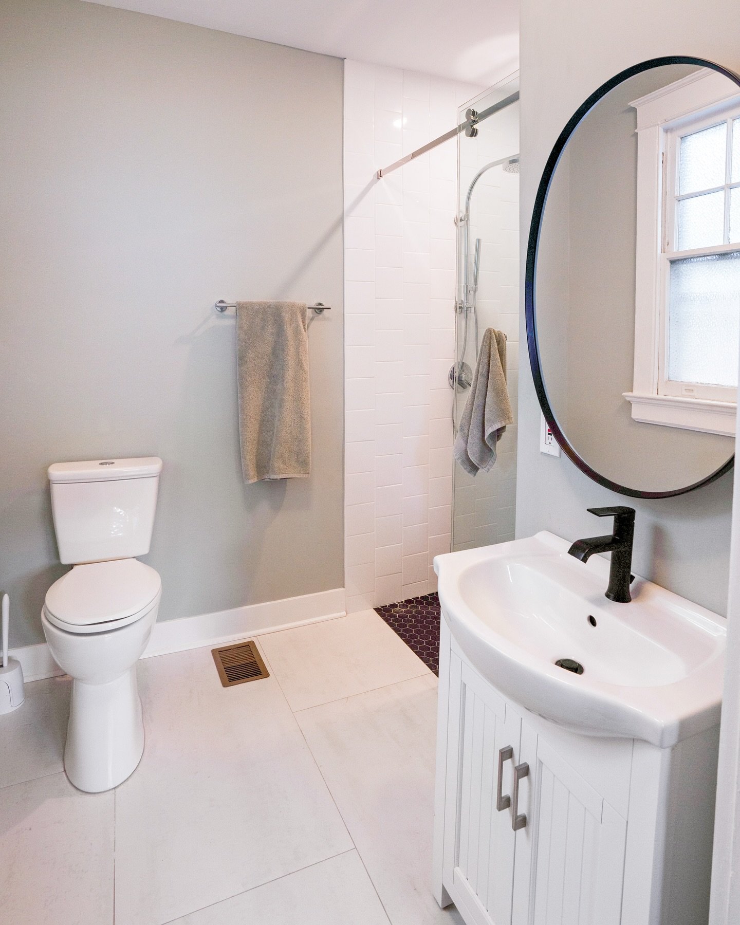 Bathroom goals alert! 🚿💦 

We're thrilled to share this stunning bathroom renovation with you! Our team expertly relocated the entrance, added a clever pocket door, and brought our client's vision to life. Take a look at the dramatic transformation