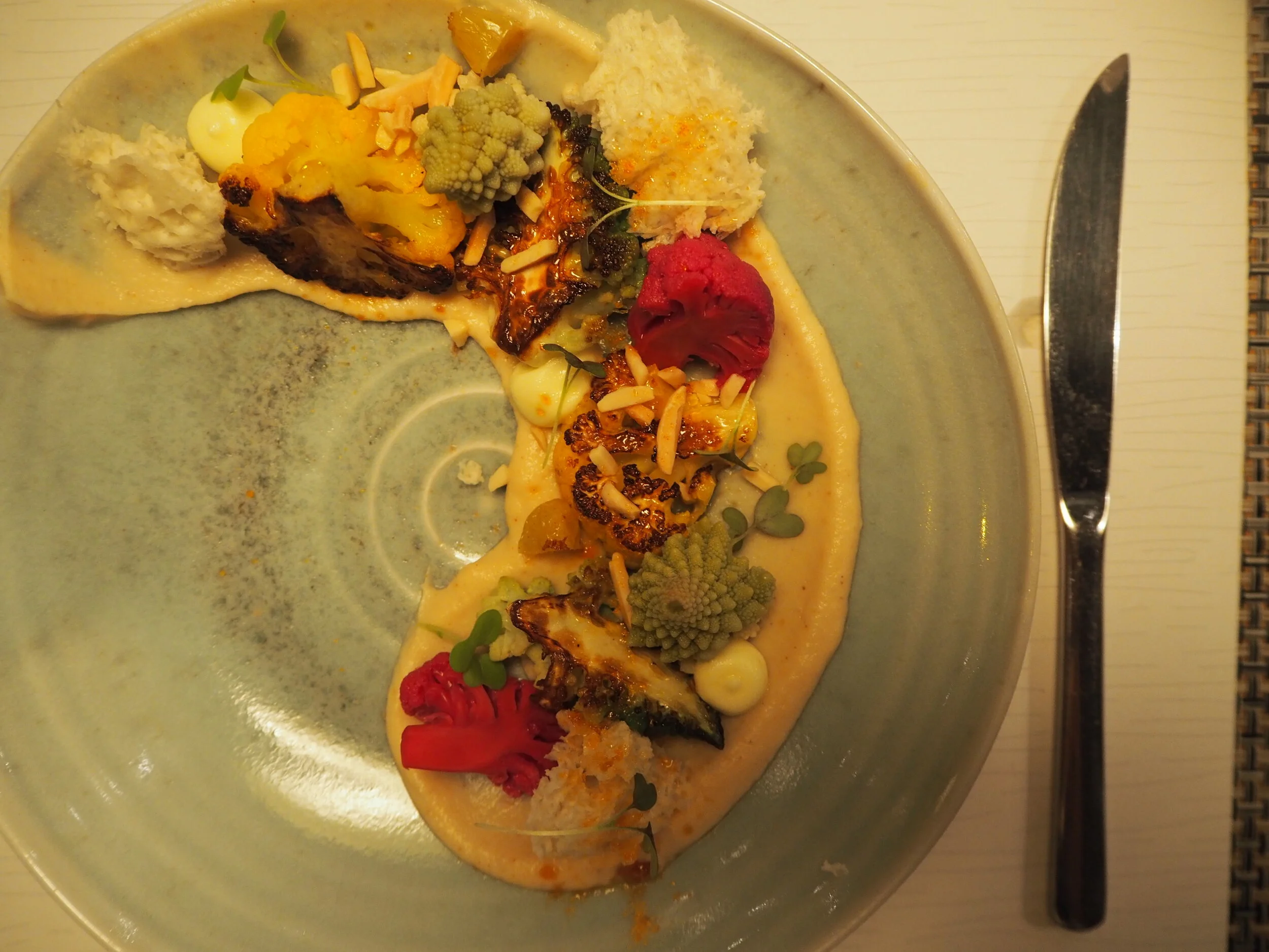 roasted cauliflower, pickled purple cauliflower, romanesco, golden raisins, roasted cauliflower spread, lemon olive oil emulsion, caramelized rock sugar