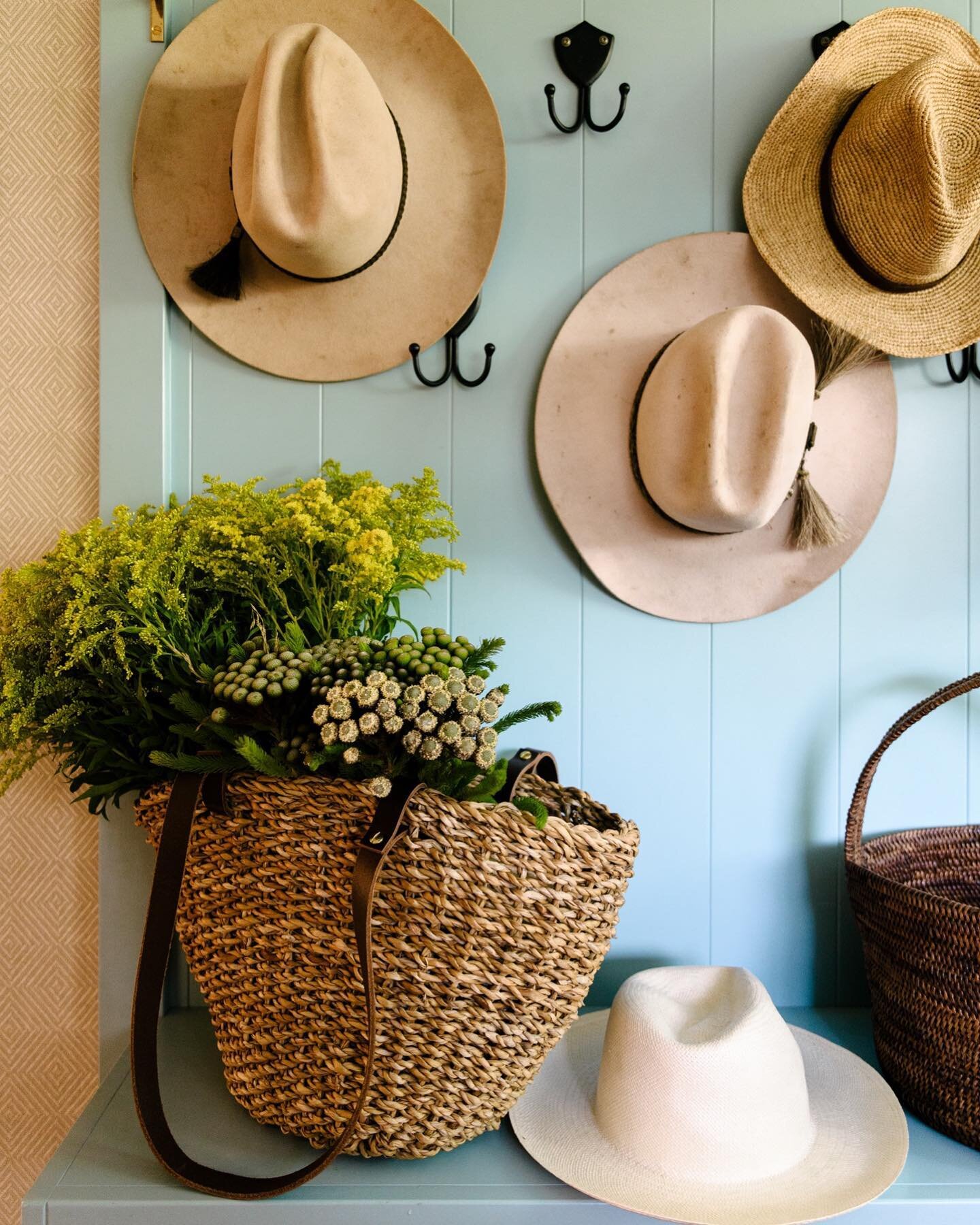 HOME BEAUTIFUL // Positioned at the back door we made the existing laundry work double time by adding this custom mudroom unit which features brass acorn finials atop the boot spikes, a multitude of hat hooks and even room for the farm coats. We adde