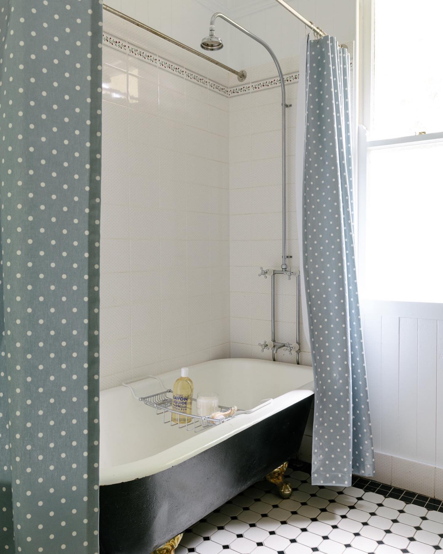 HOME BEAUTIFUL // The original bathroom was so delightful and full of character we simply painted it, added a custom shower curtain over the claw foot bath and installed a freestanding furniture piece - not so simple as it turns out but completely wo