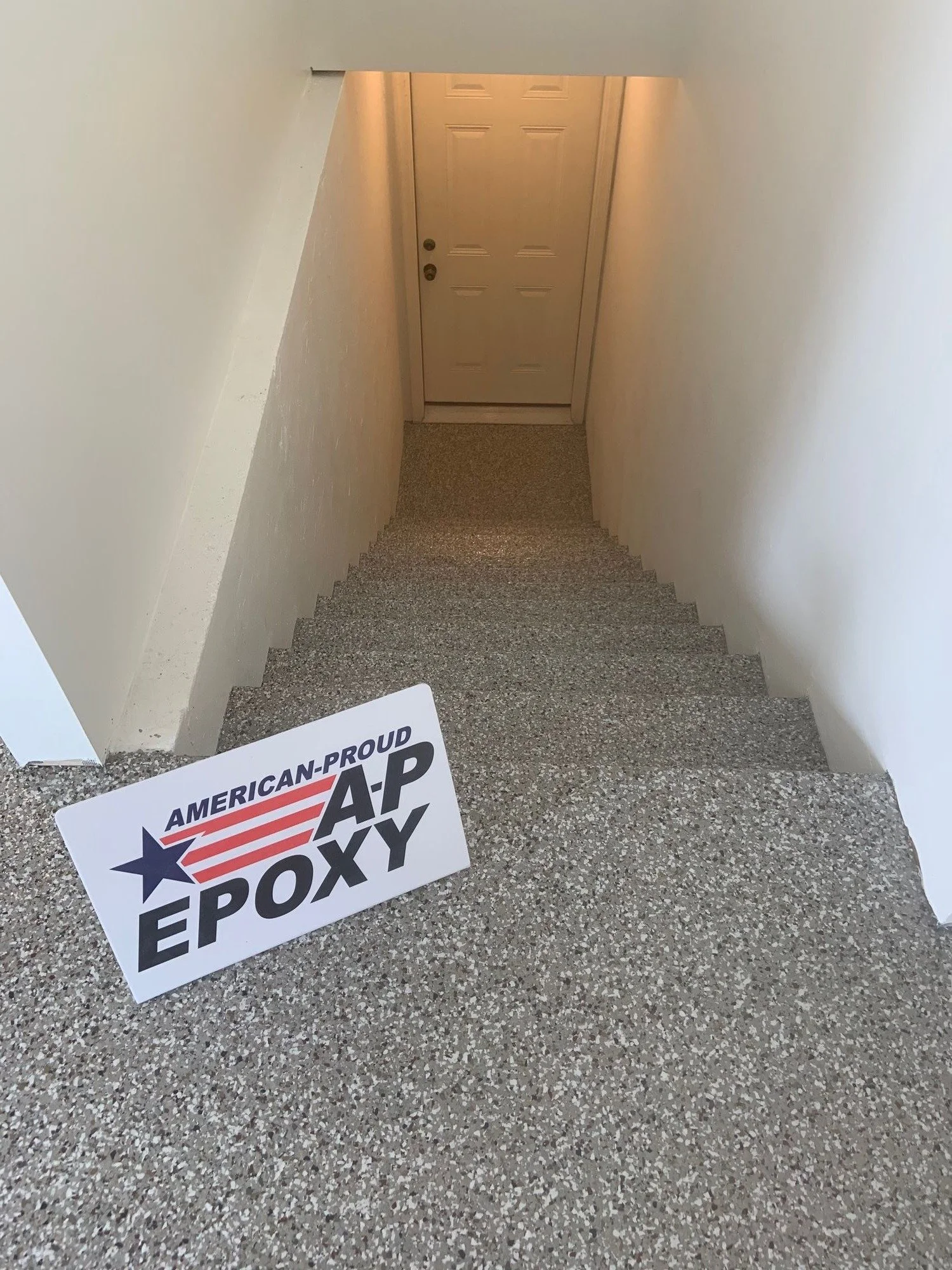 ap-epoxy-creekbed-basement-stairs-floor-01.jpg