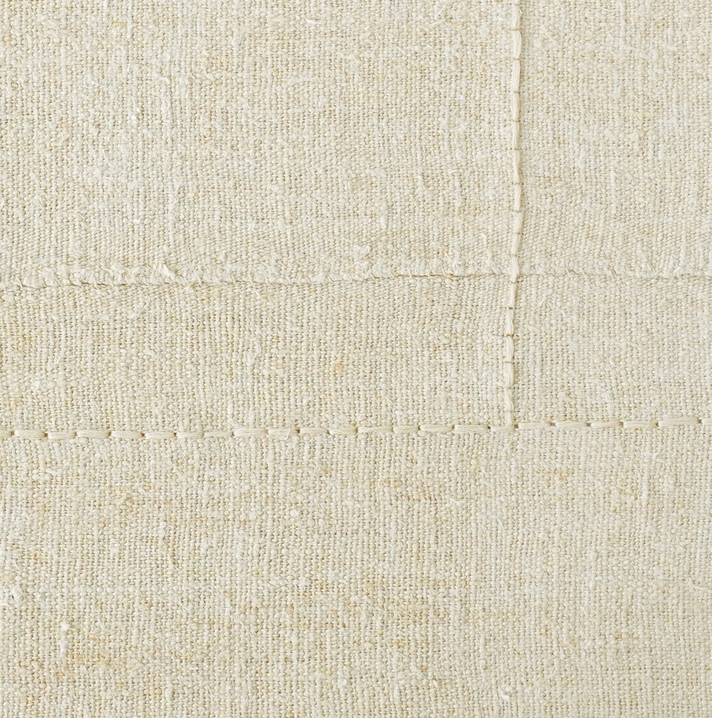 detail of hand-stitched vintage grain sack on canvas.