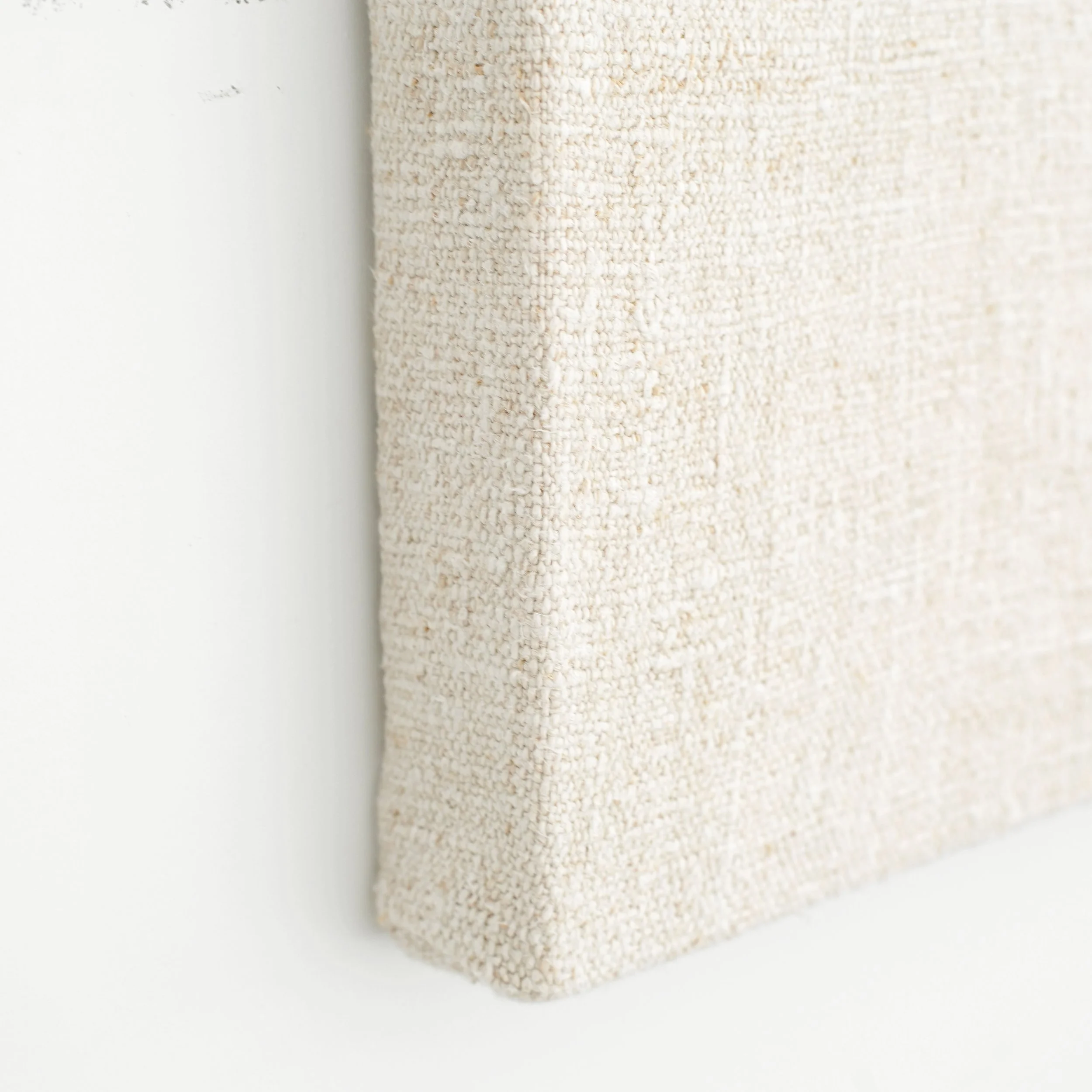 detail of vintage grain sack on hanging on wall.