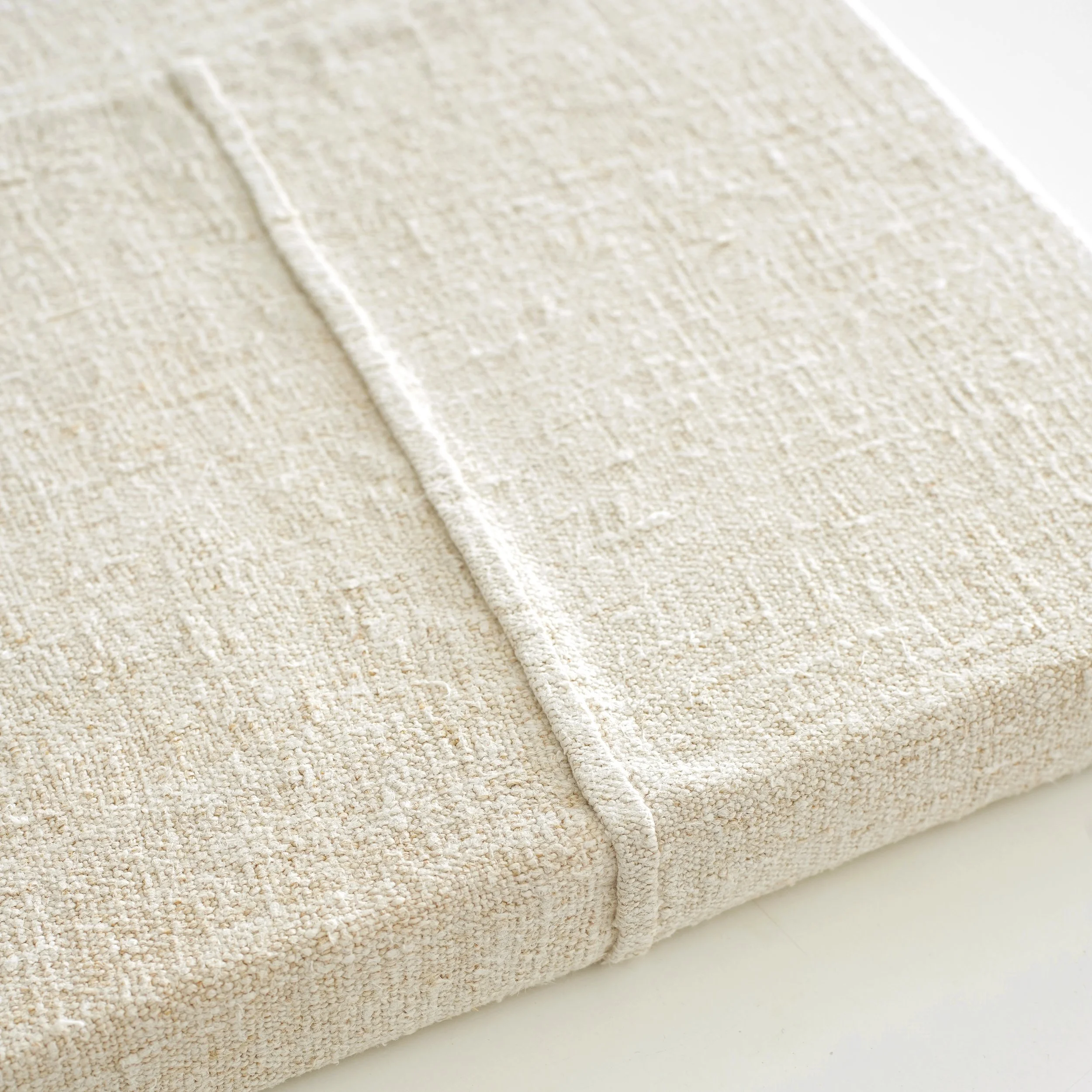 detail of hand-stitched vintage grain sack on canvas.