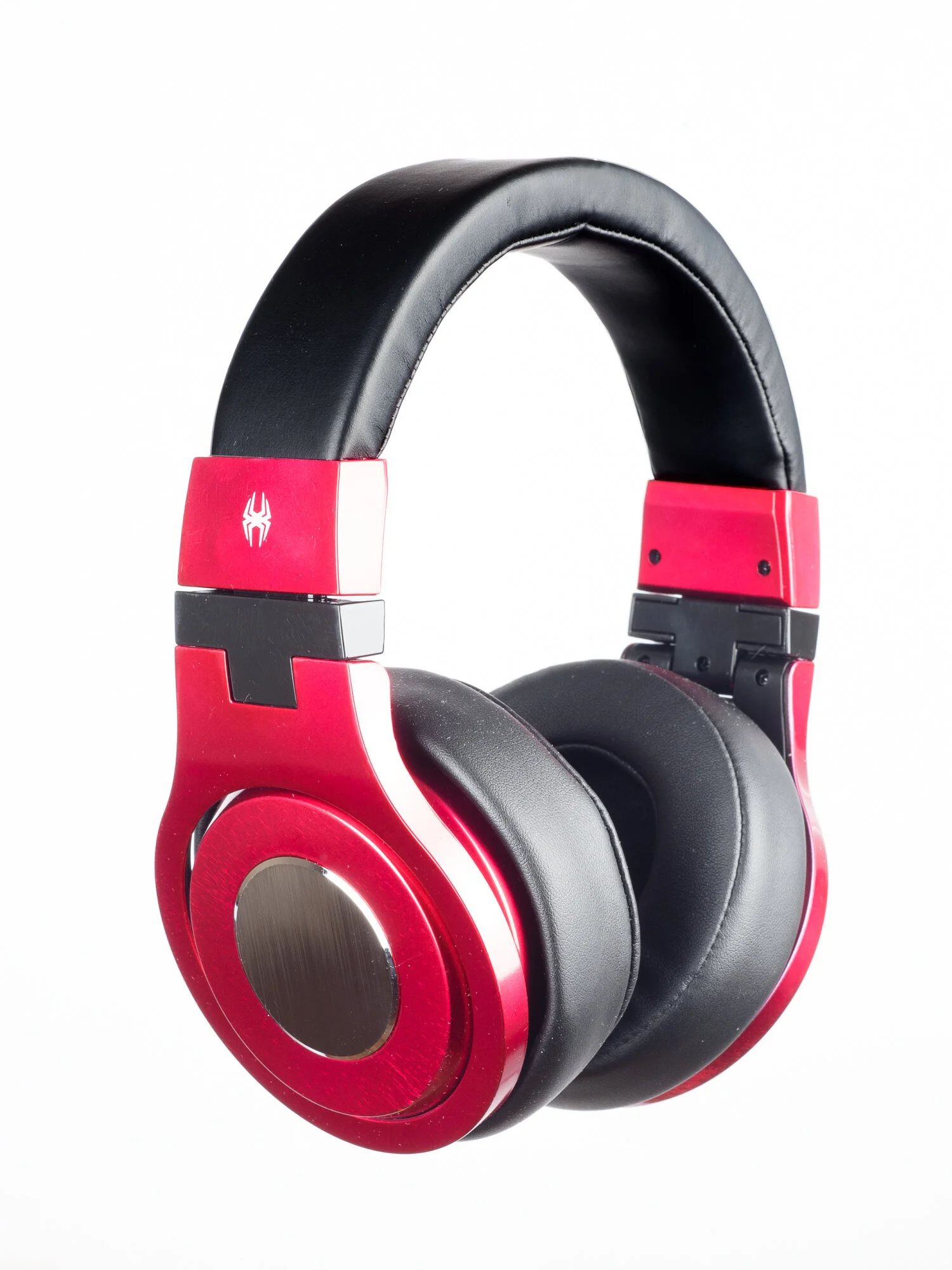 Red and black over-ear headphones with a headband and circular ear cups.