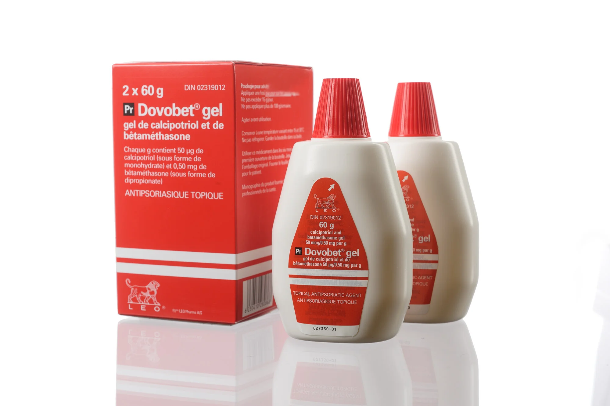 Dovobet gel packaging with two bottles and a box reflecting on a white surface.