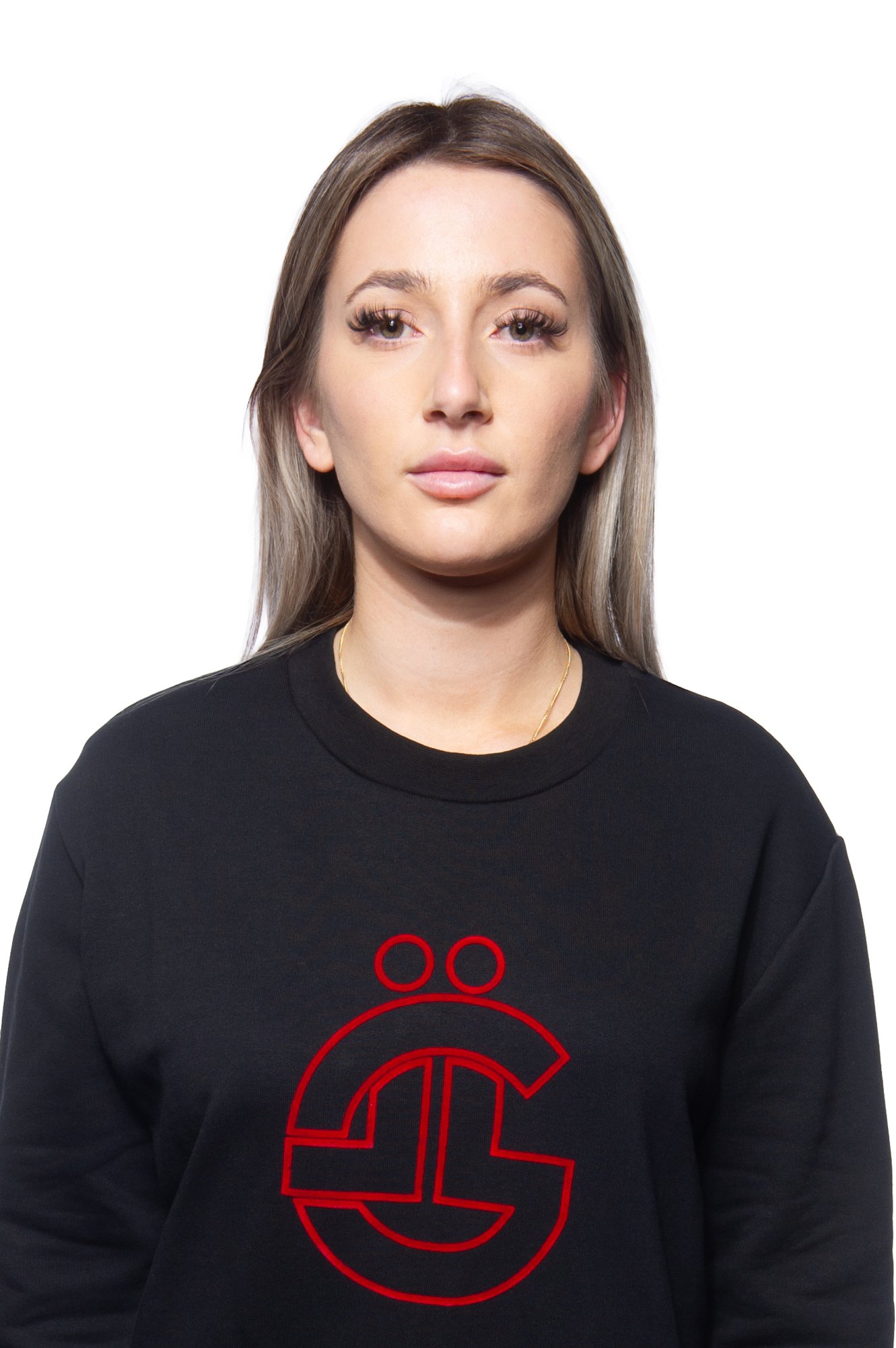 Woman with long hair wearing a black sweatshirt