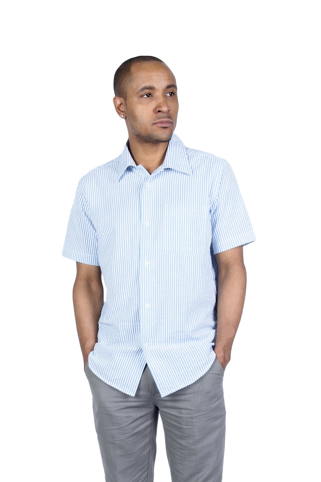 Man wearing blue striped short-sleeve shirt and gray pants against white background.