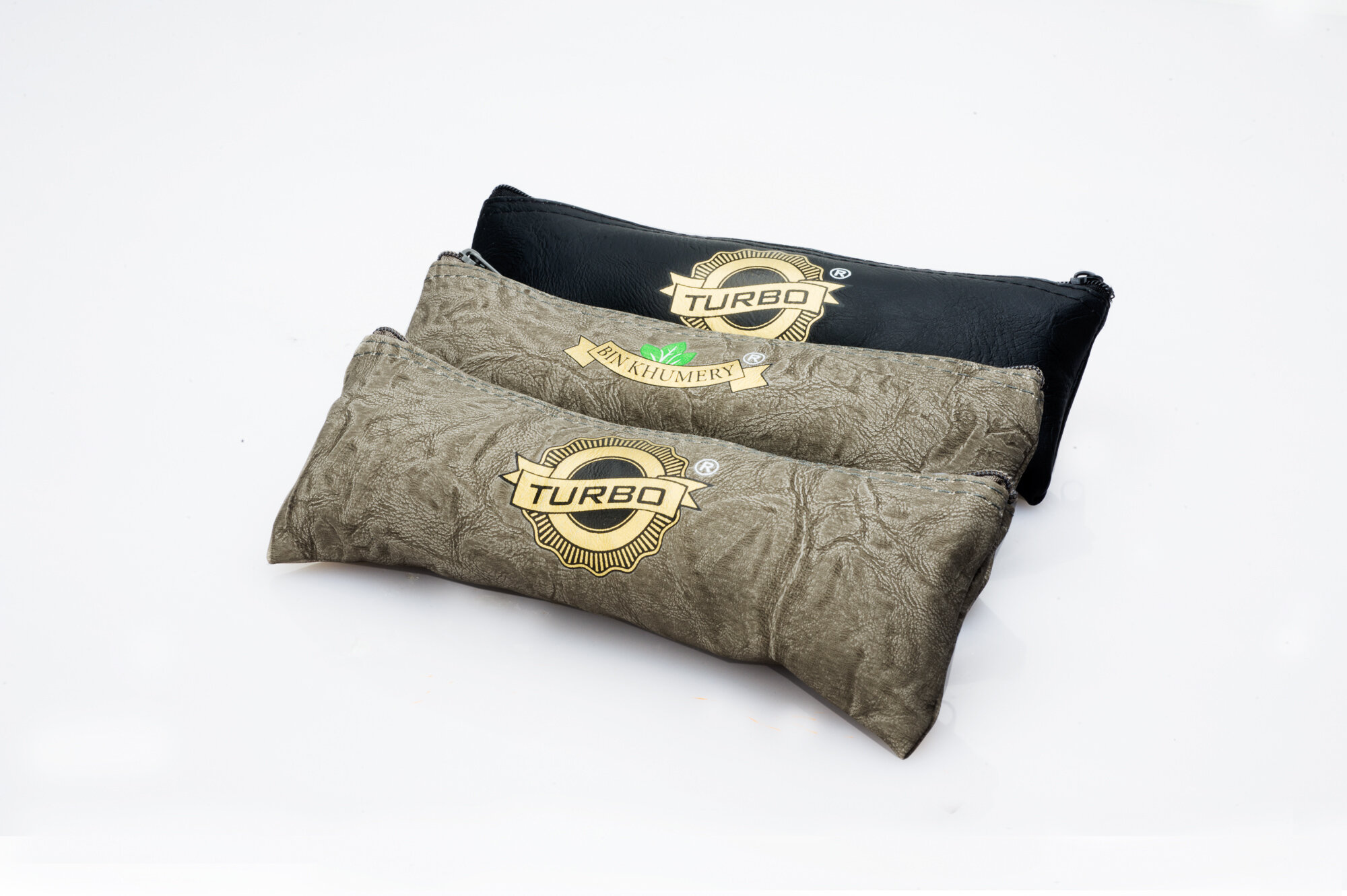 Three Turbo-branded zippered pouches in neutral colors on a white background.