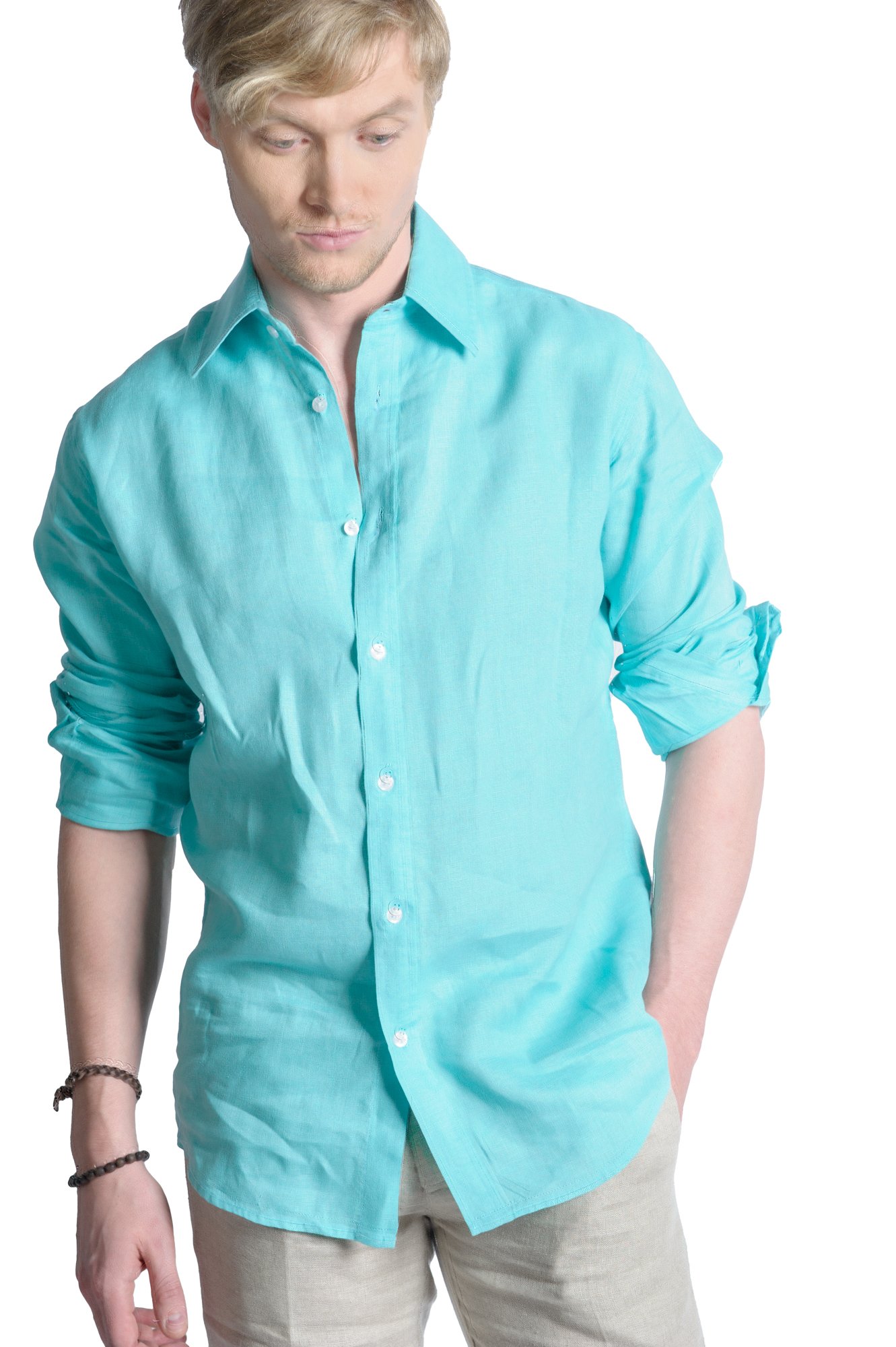 Person wearing a light blue button-up shirt with rolled-up sleeves and light pants.