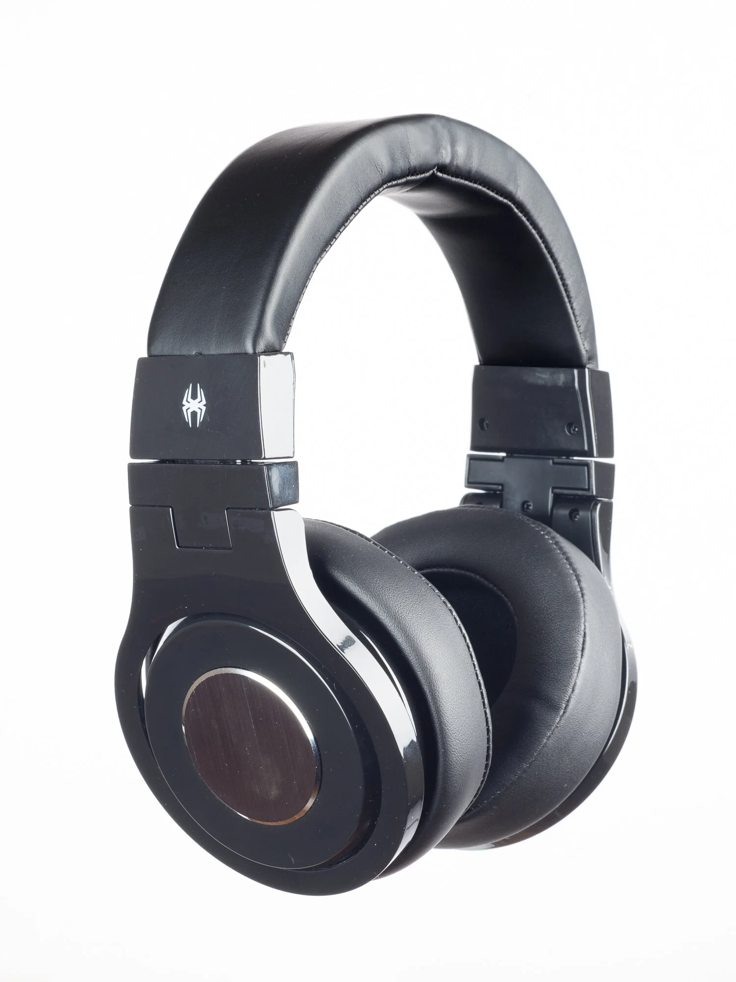 Black over-ear headphones with padded ear cups and a metal accent on the sides, displayed against a white background.