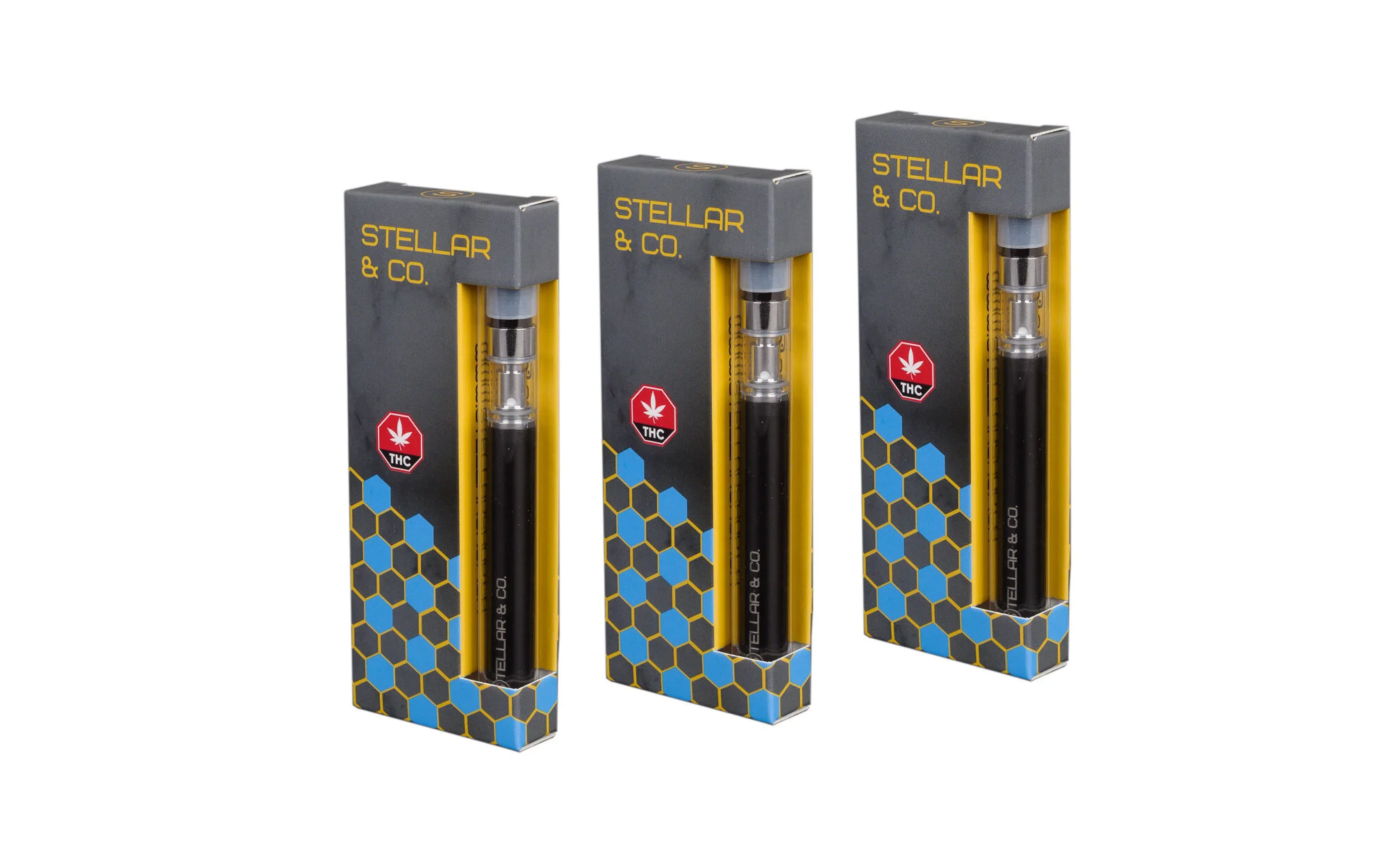 Three vape cartridges in boxes labeled 'Stellar & Co.' with THC symbols and hexagonal patterns.