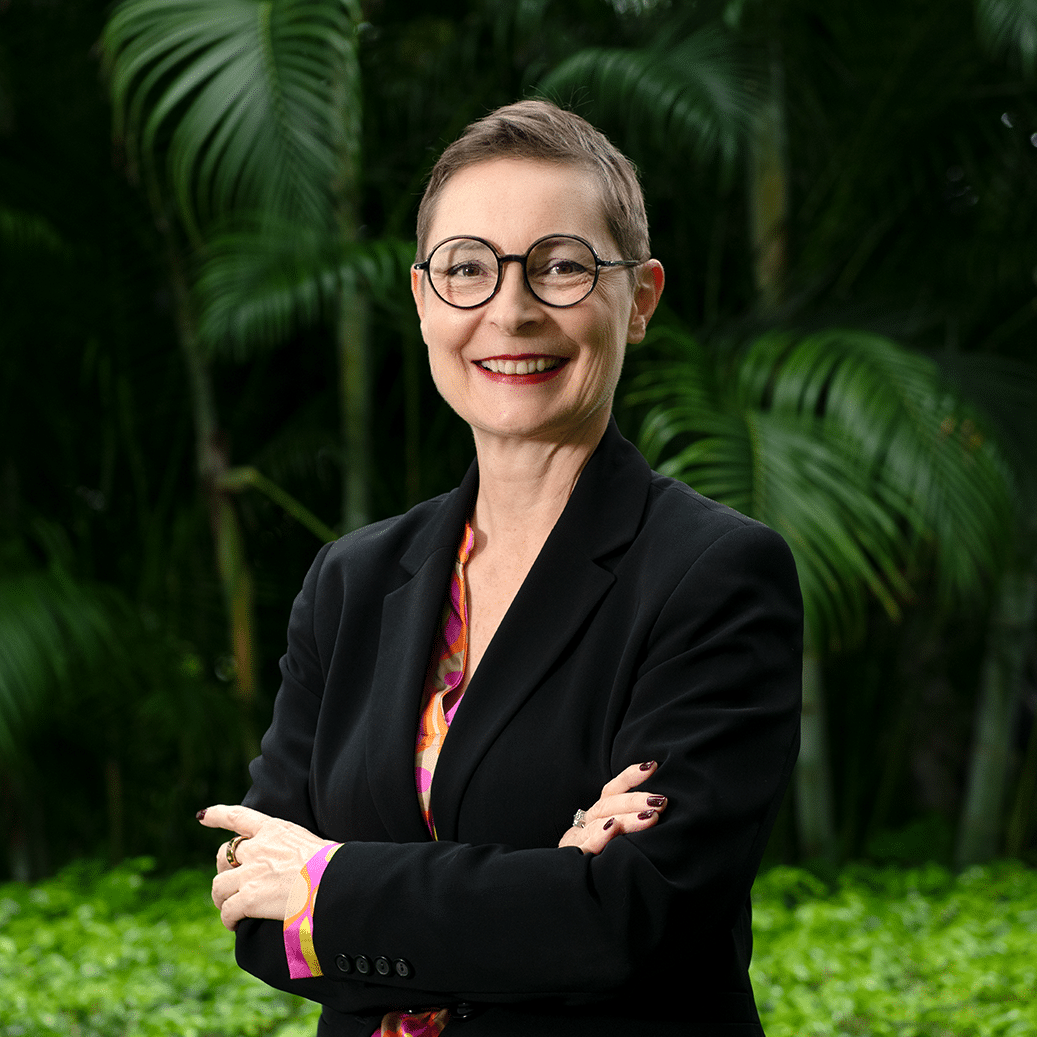 A photo of a woman with short hair and glasses
