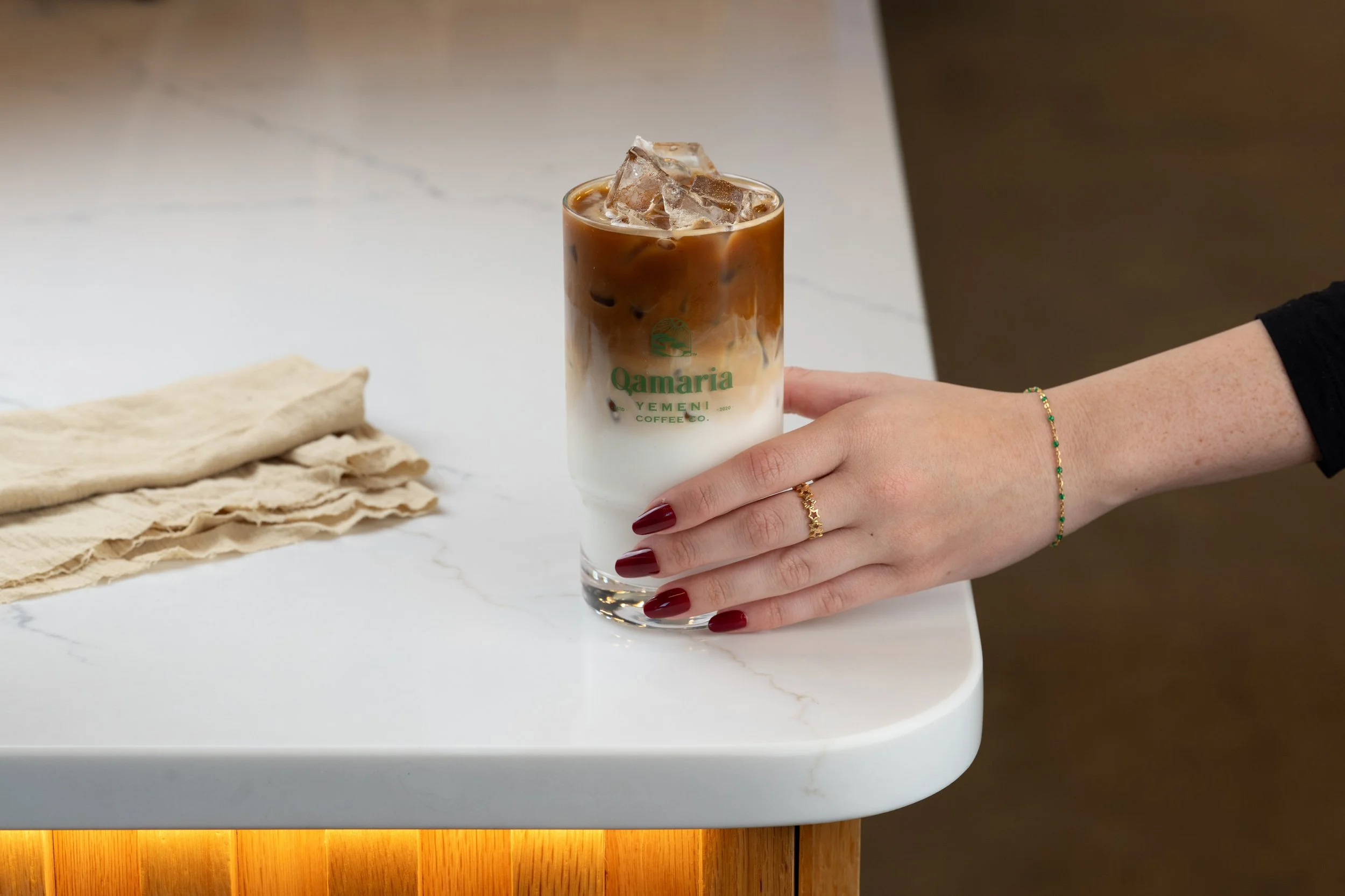 Qamaria-Espresso-Iced-Latte-Hand-2.jpg