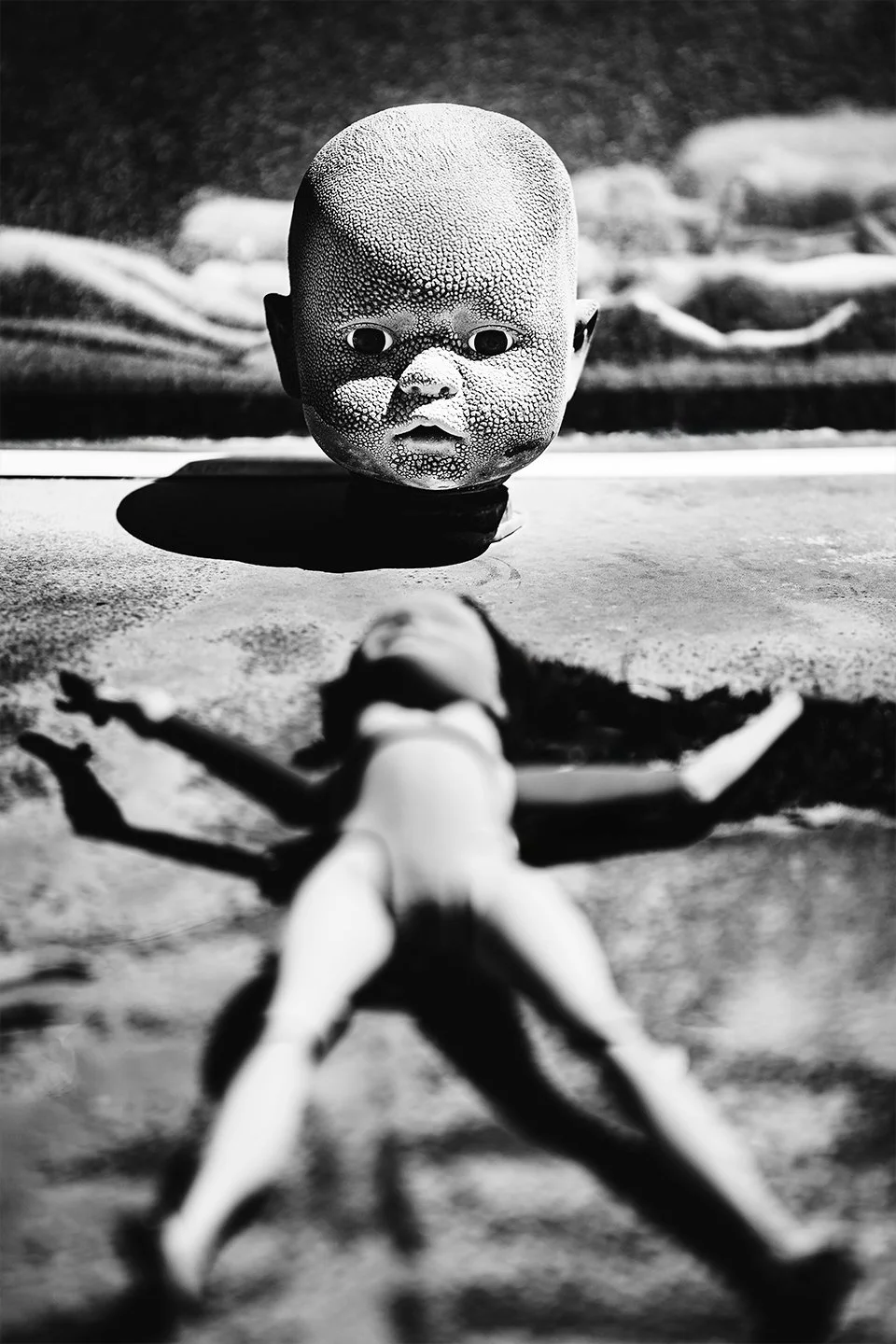 Doll-head-with-Barbie-in-foreground.jpg