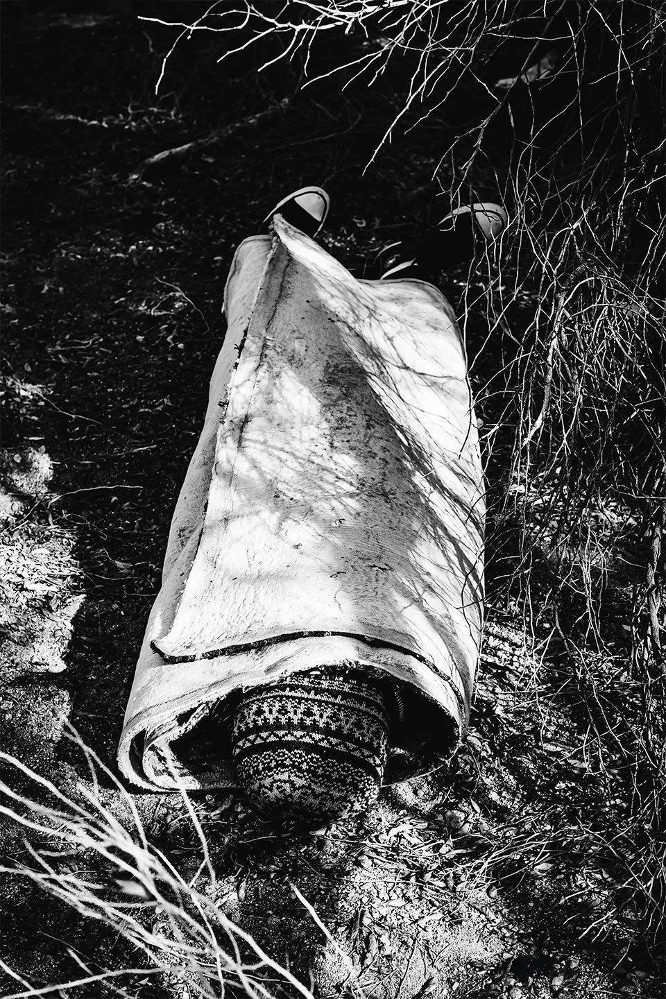 Body-wrapped-in-carpet.jpg