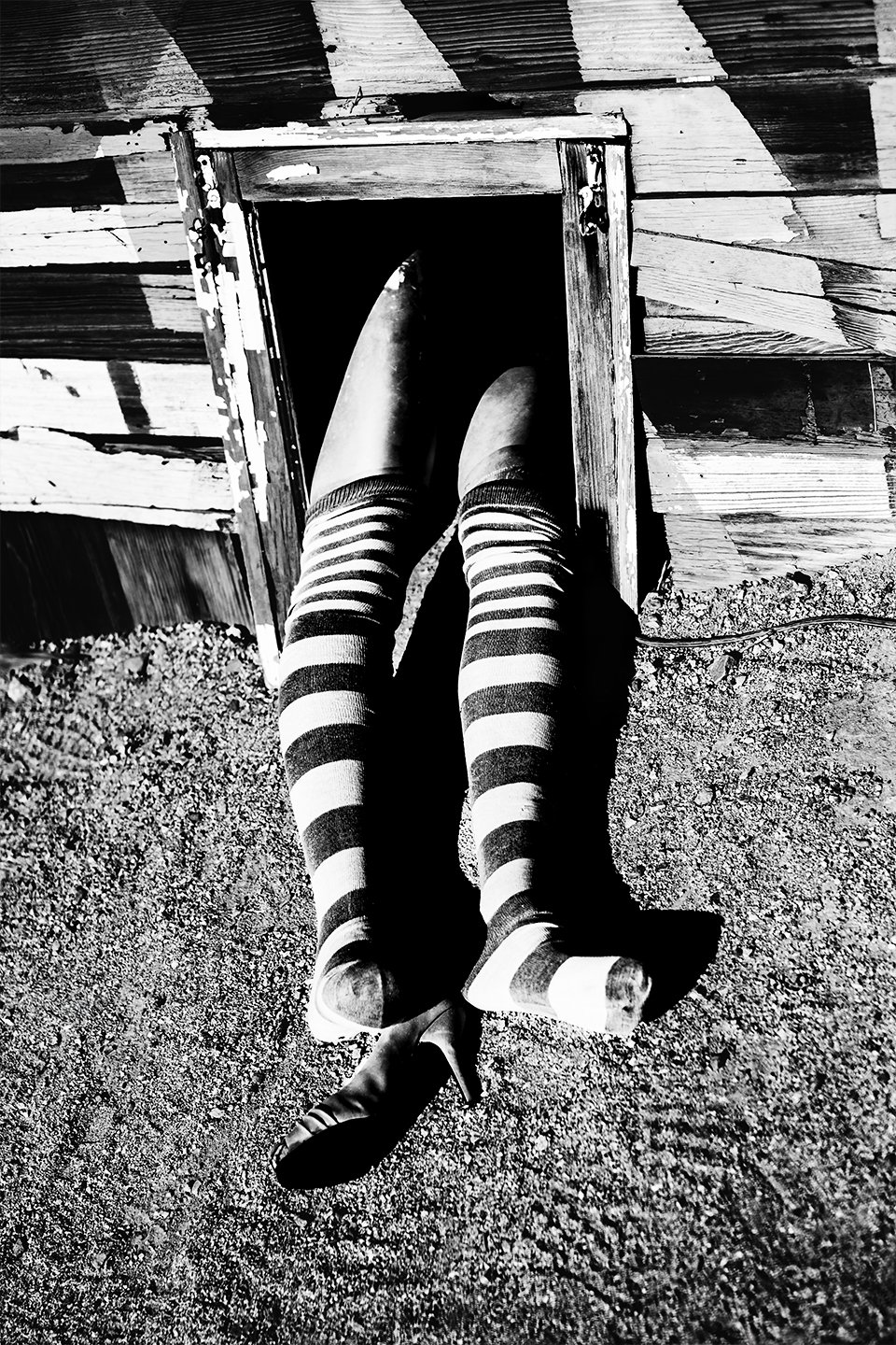 Stripe-legs-sticking-out-of-house.jpg