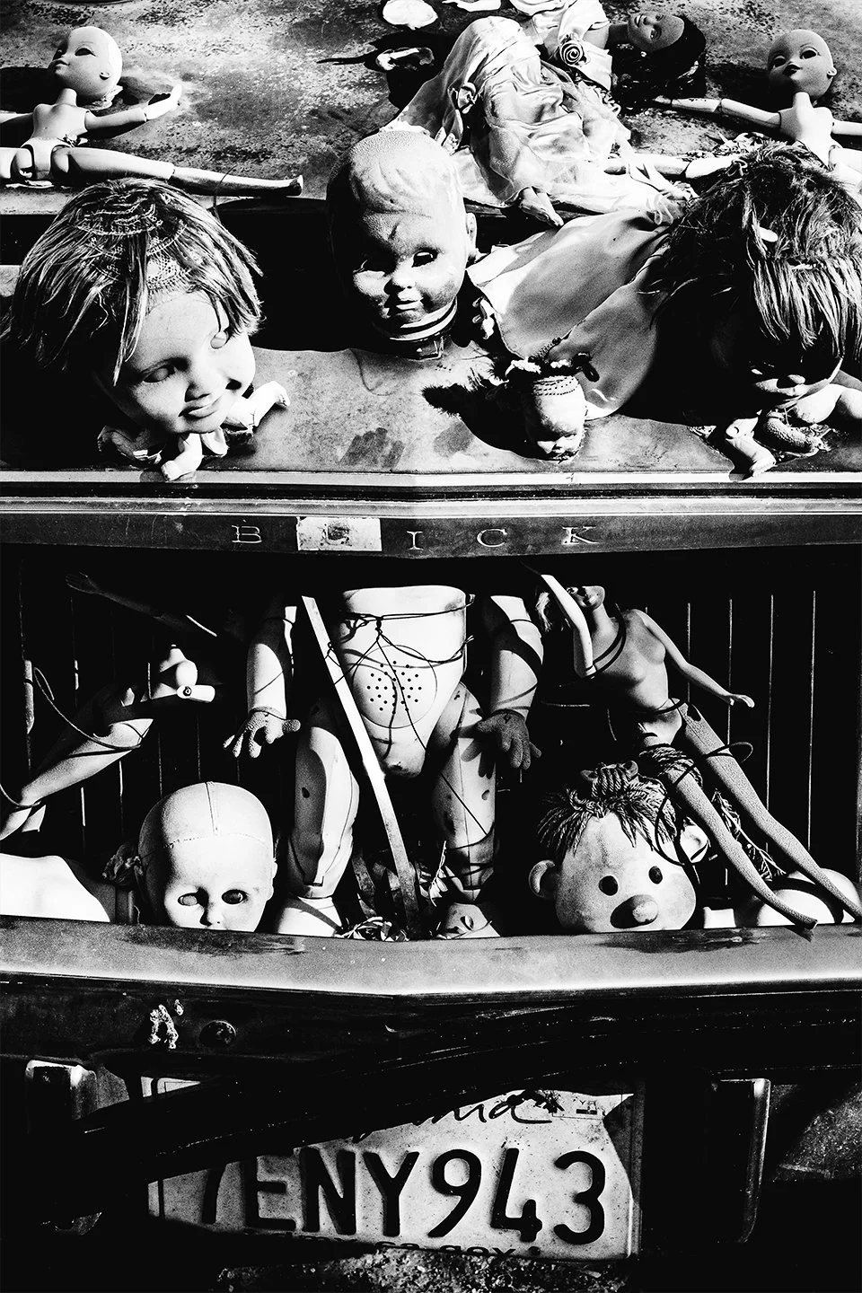 Doll-heads-in-Buick.jpg