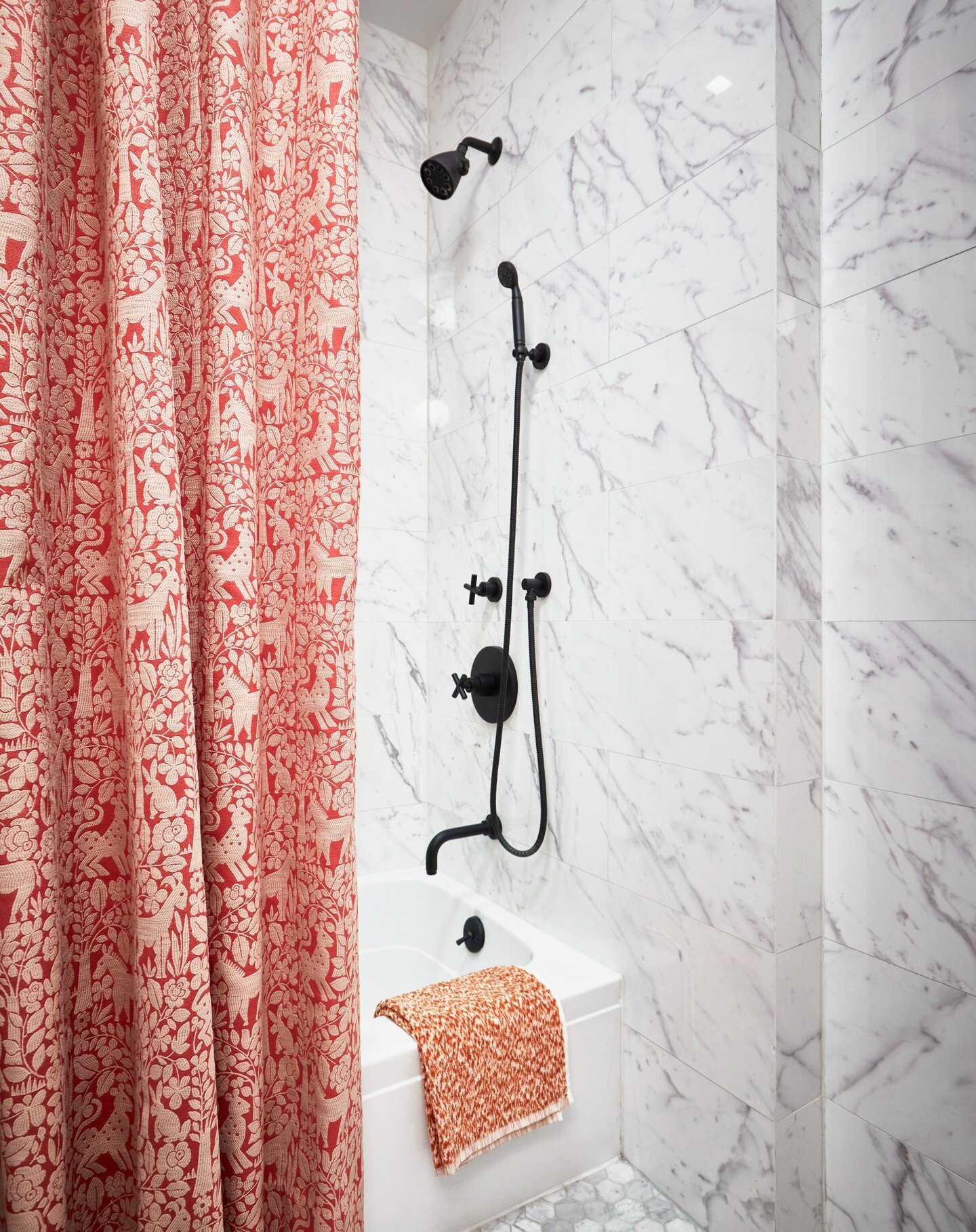 In honor of Valentine's Day, I wanted to share the guest bathroom from our UES pre-war project. ❤️ This show-stopping embroidered fabric adds sophistication and a touch of whimsy to a timeless gray and white marble bathroom. 

Pro tip: Install the sh