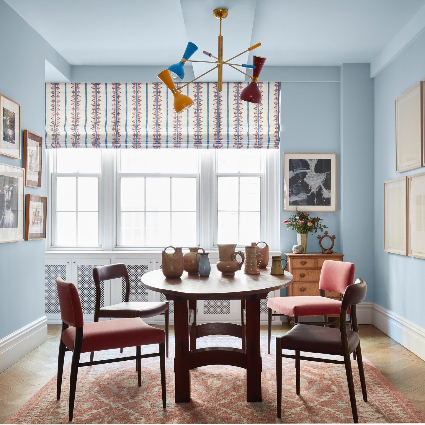 There is so much to love in the dining room from a recent UES project: a contrappeso chandelier from Artemest, dining chairs from Julian Chichester, Anna French fabric on the window treatments, and a custom rug from Beauvais. The client's own artwork