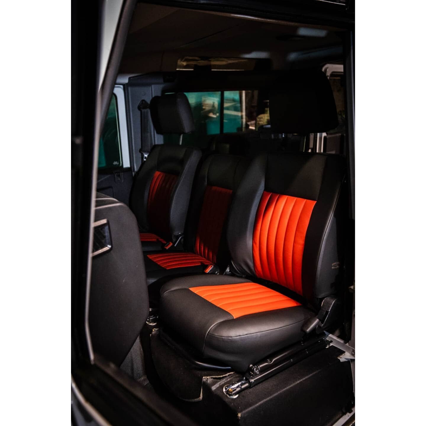 I have to admit, when I heard Matt and his customer picking out bright red, tuck and roll type inserts for these defender seats, I had my reservations...

But what a result on the final product. They really work well to break up the otherwise, black 