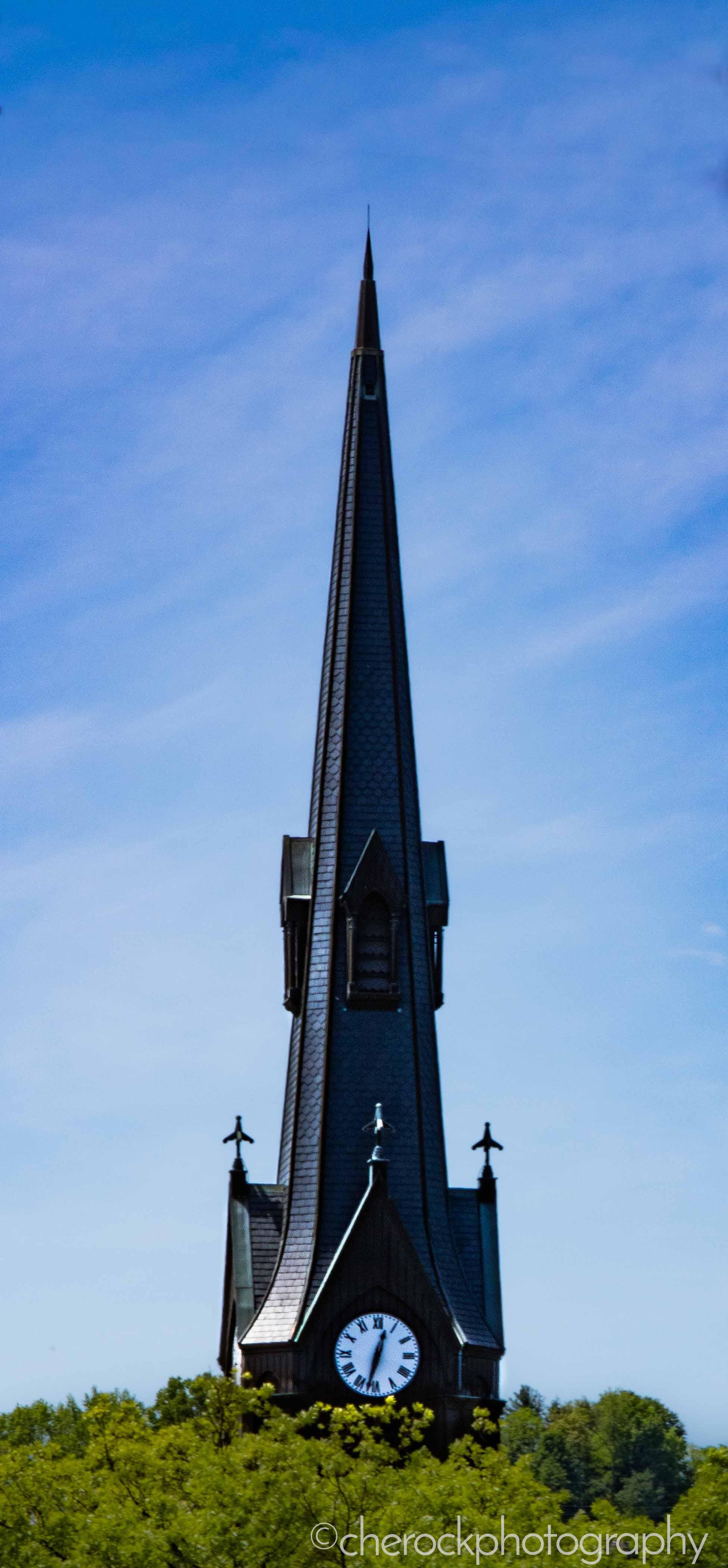 Clock Tower of the Sewickley United Methodist Church rises above the treeline