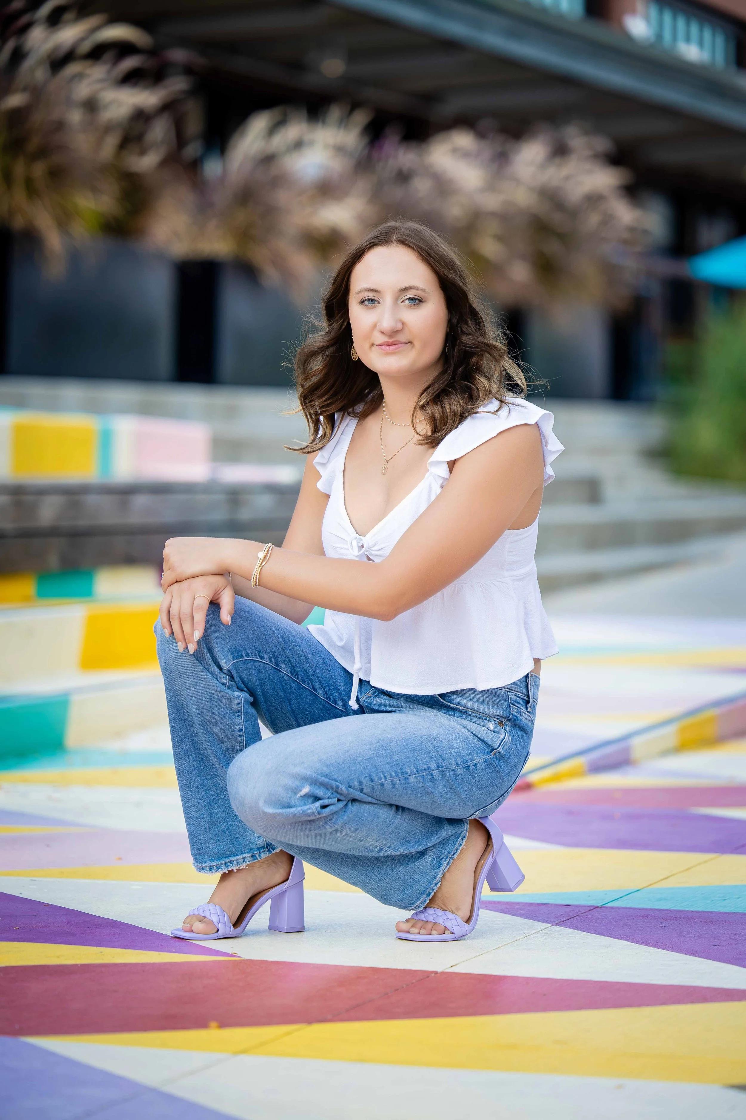 senior photos girl on colored sidewalk