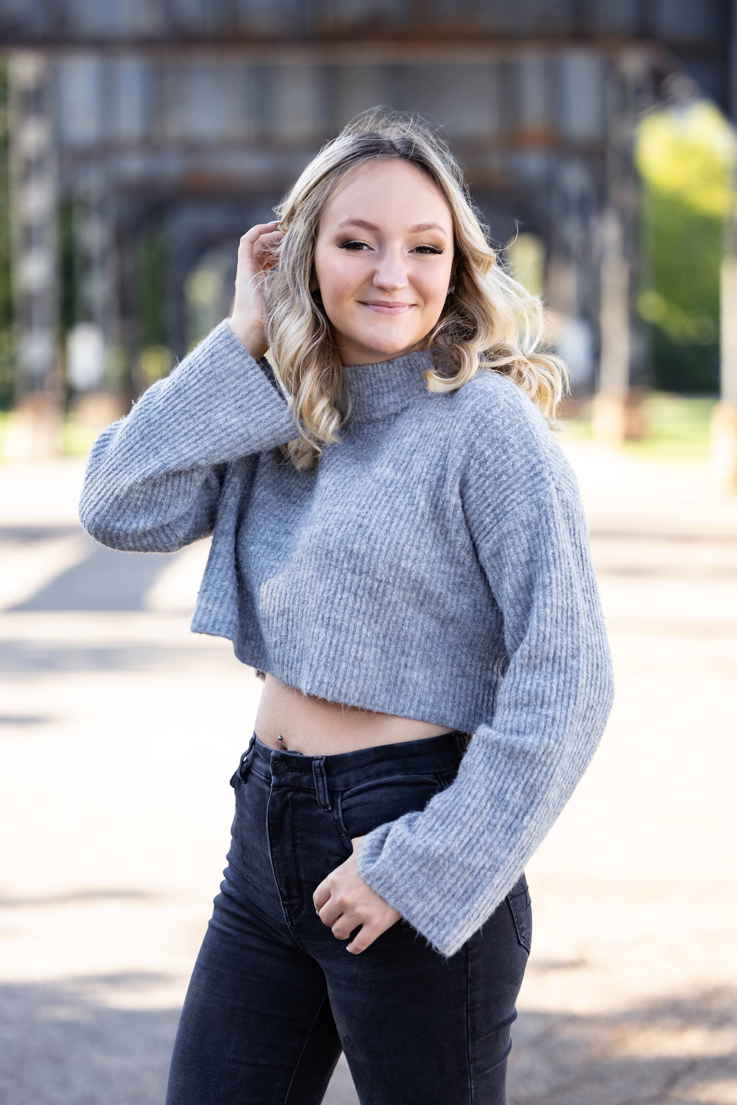Smiling Girl Senior Photos under Pittsburgh bridge