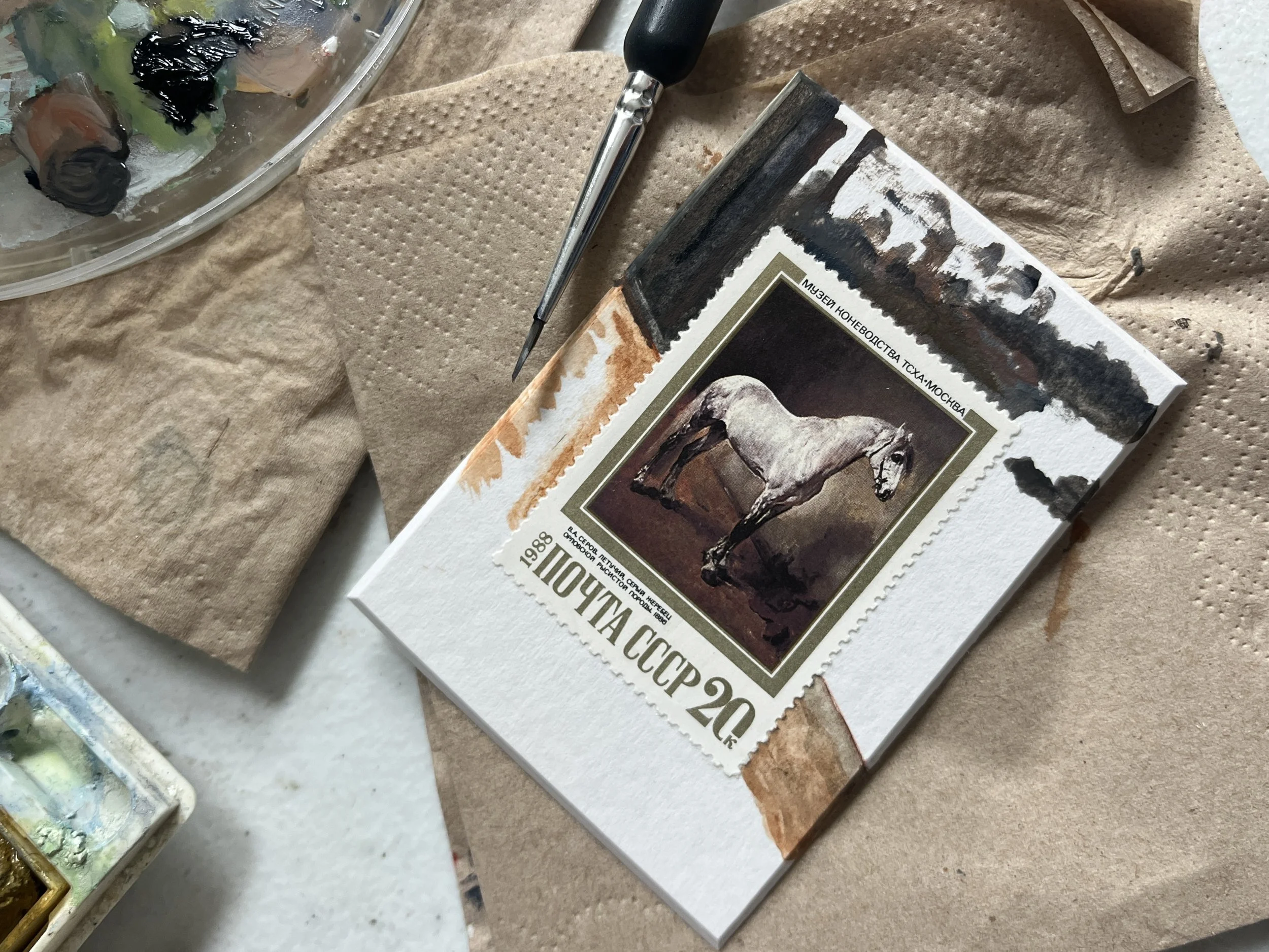 ussr horse painting on a postage stamp with a painted background showing a grey brown toned abstract painting of the stable background with the background currently being painted