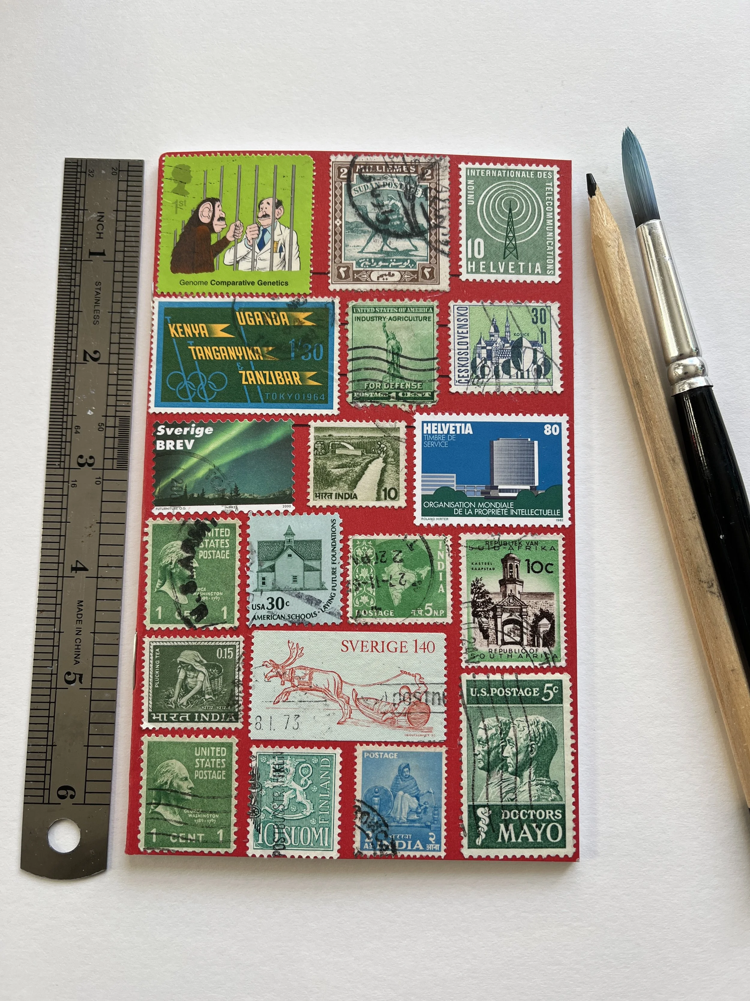 Vintage Stamp-Covered Lined Notebook