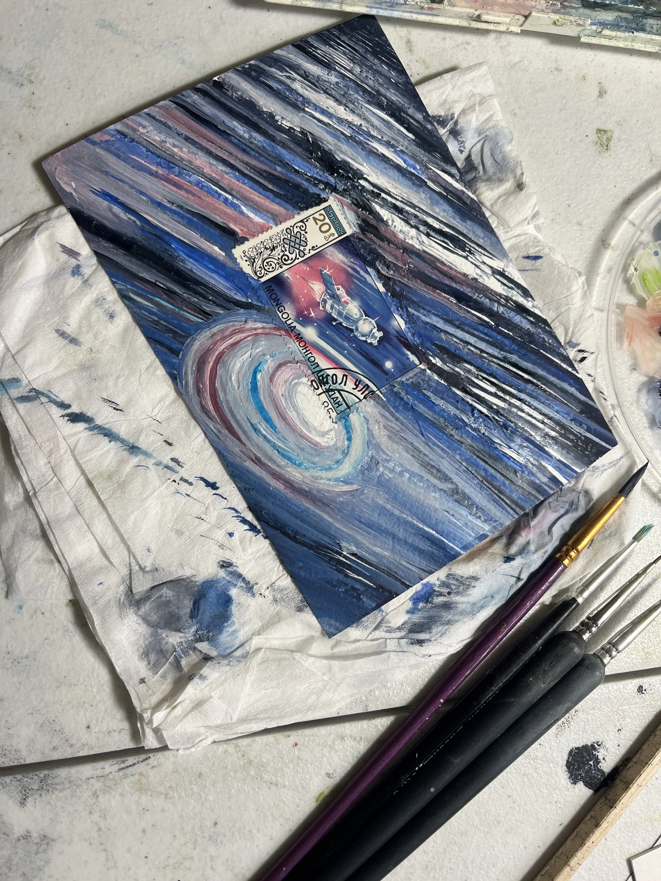 a space artwork with paint brushes