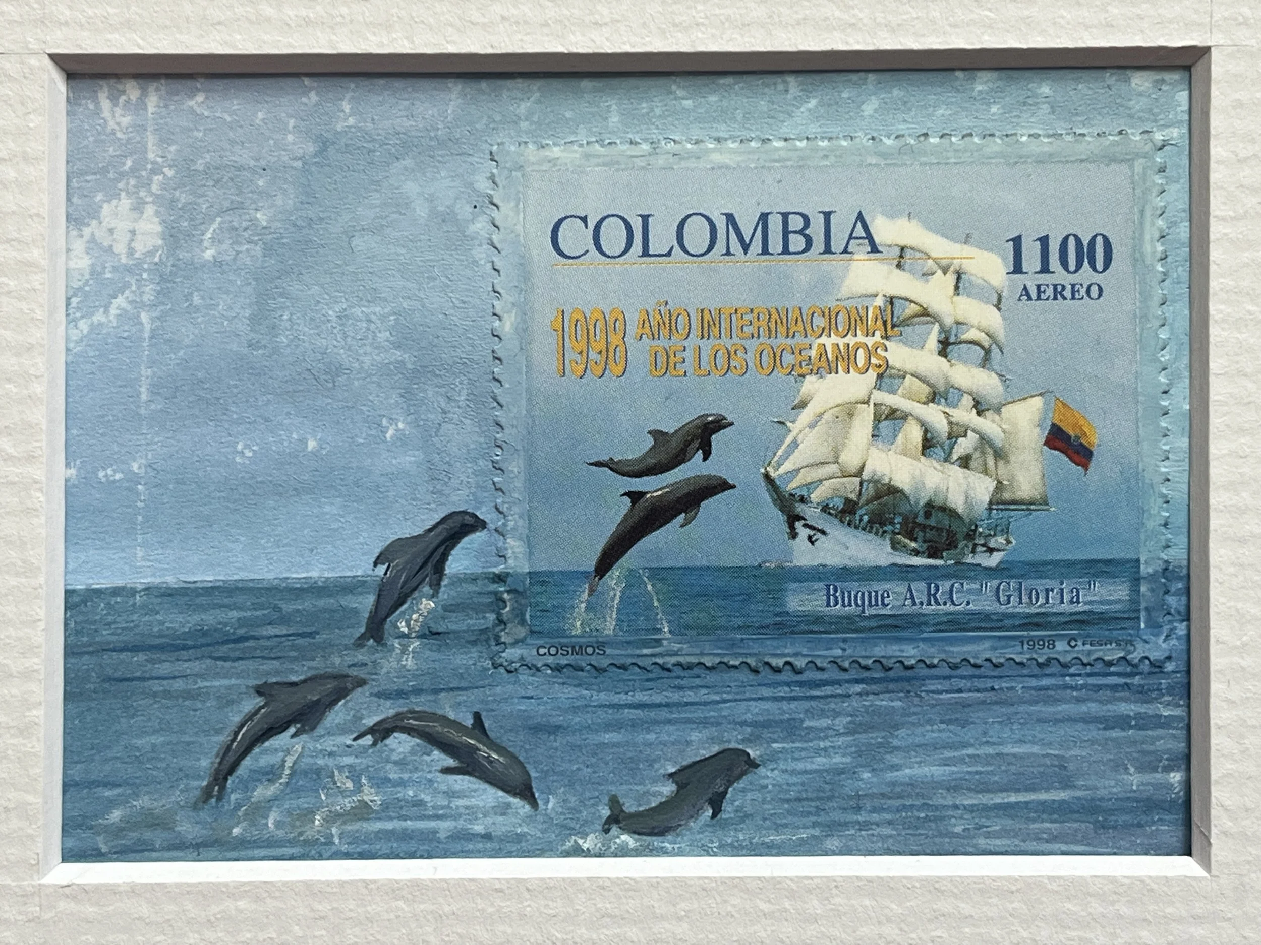 Dolphins  leading in the sea around a ship shown in this Nautical Colombia Postage Stamp Art.