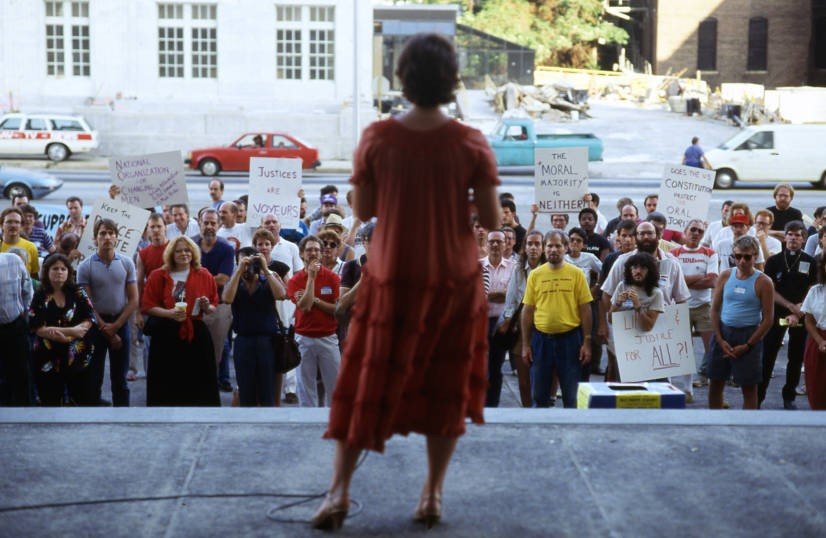  Attorney Kathy Wilde, addressing a crowd of gay rights demonstrators at the Richard B. Russell Federal Building in 1986.  Photo credit: Atlanta Journal-Constitution Photographic Archives. Special Collections and Archives, Georgia State University Li