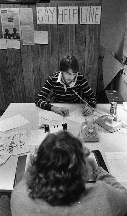  Michael Wilson answering calls at the Gay Help Line at the Atlanta Gay Center in 1985.  Photo credit: Atlanta Journal-Constitution Photographic Archives. Special Collections and Archives, Georgia State University Library 